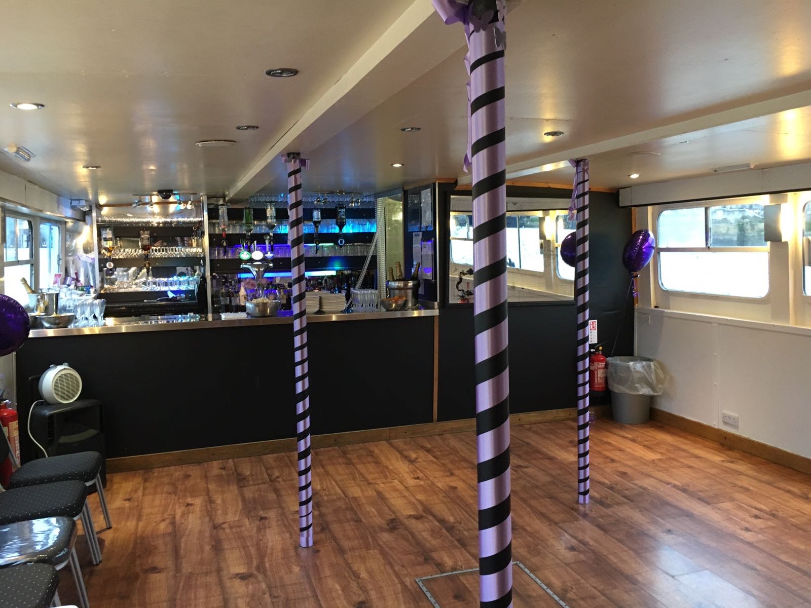 Versatile event space on MV Arcadian King Edward with bar area, ideal for gatherings.
