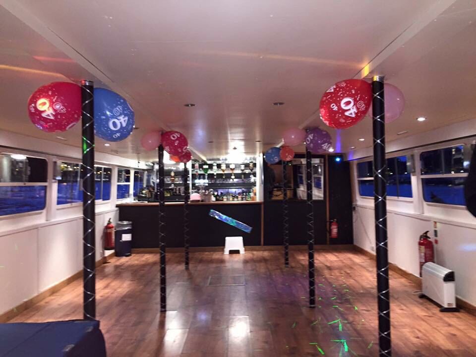 Vibrant event space with colorful balloons, ideal for parties and celebrations.