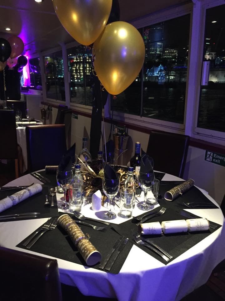 Elegant dining table in black and gold for corporate events on MV Arcadian King Edward.