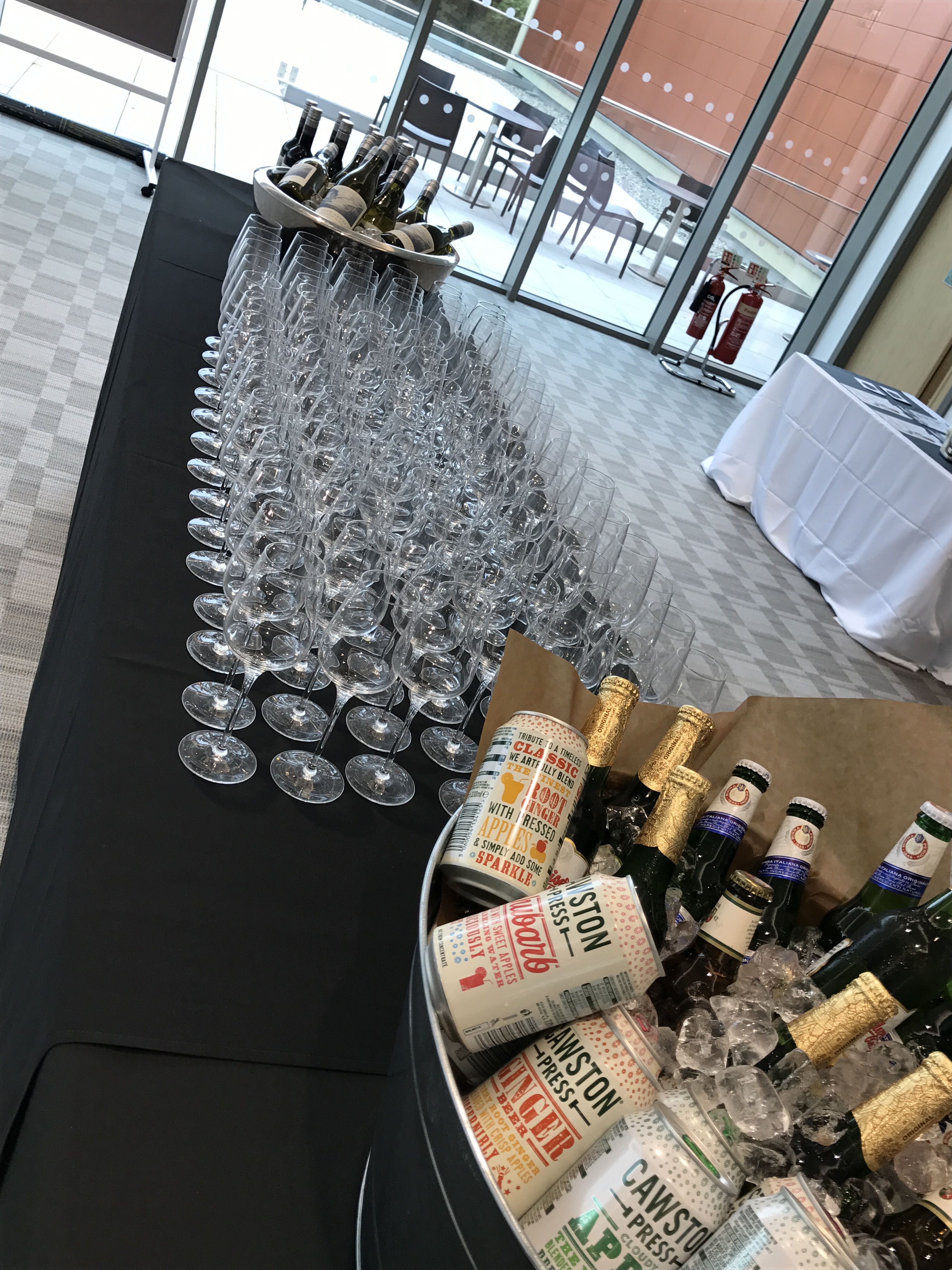 Sparkling wine glasses arranged for a sophisticated celebration at King’s Hedges, Cambridge.