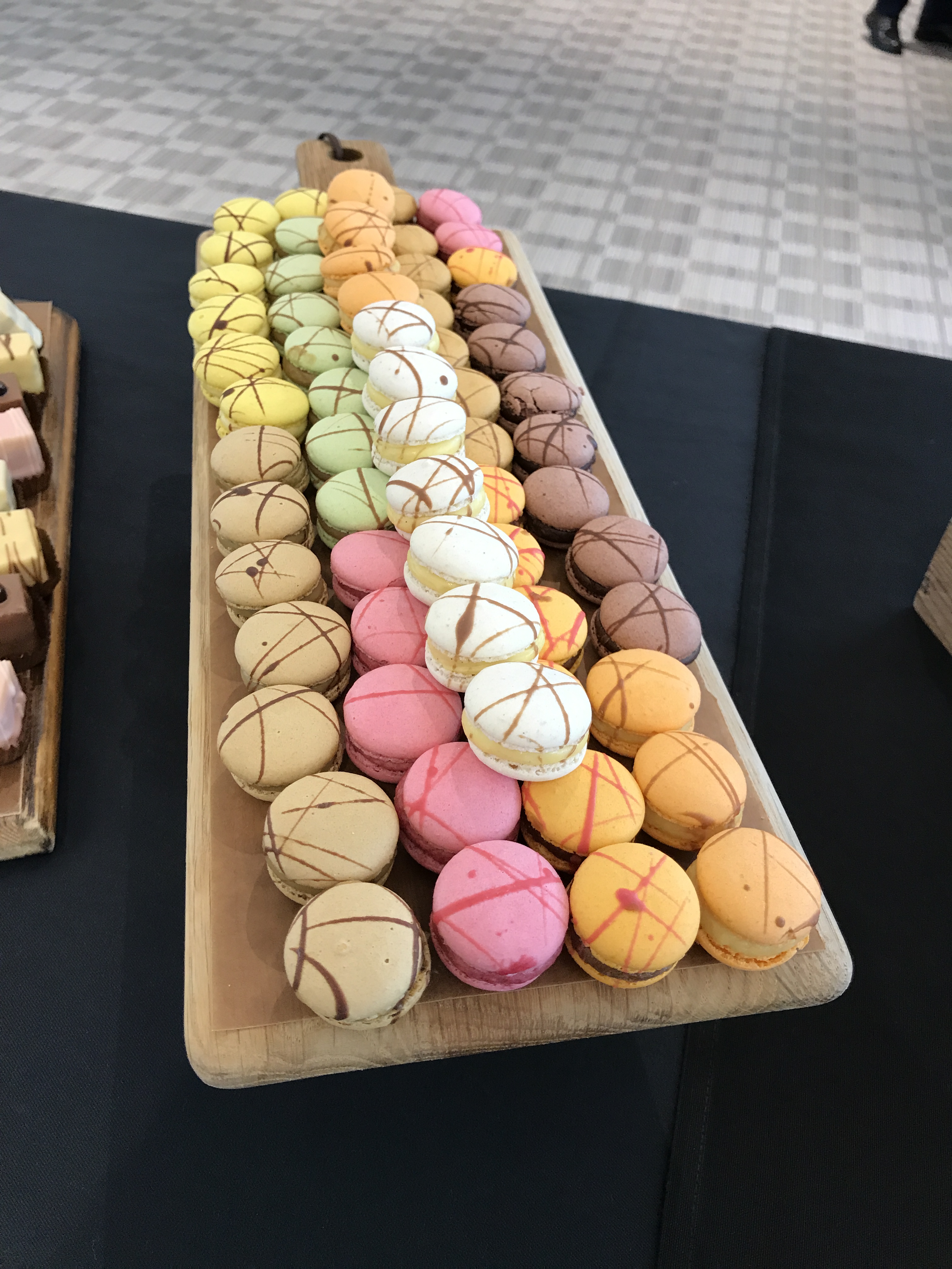 Colorful macarons display at King’s Hedges, perfect for elegant events and dessert tables.