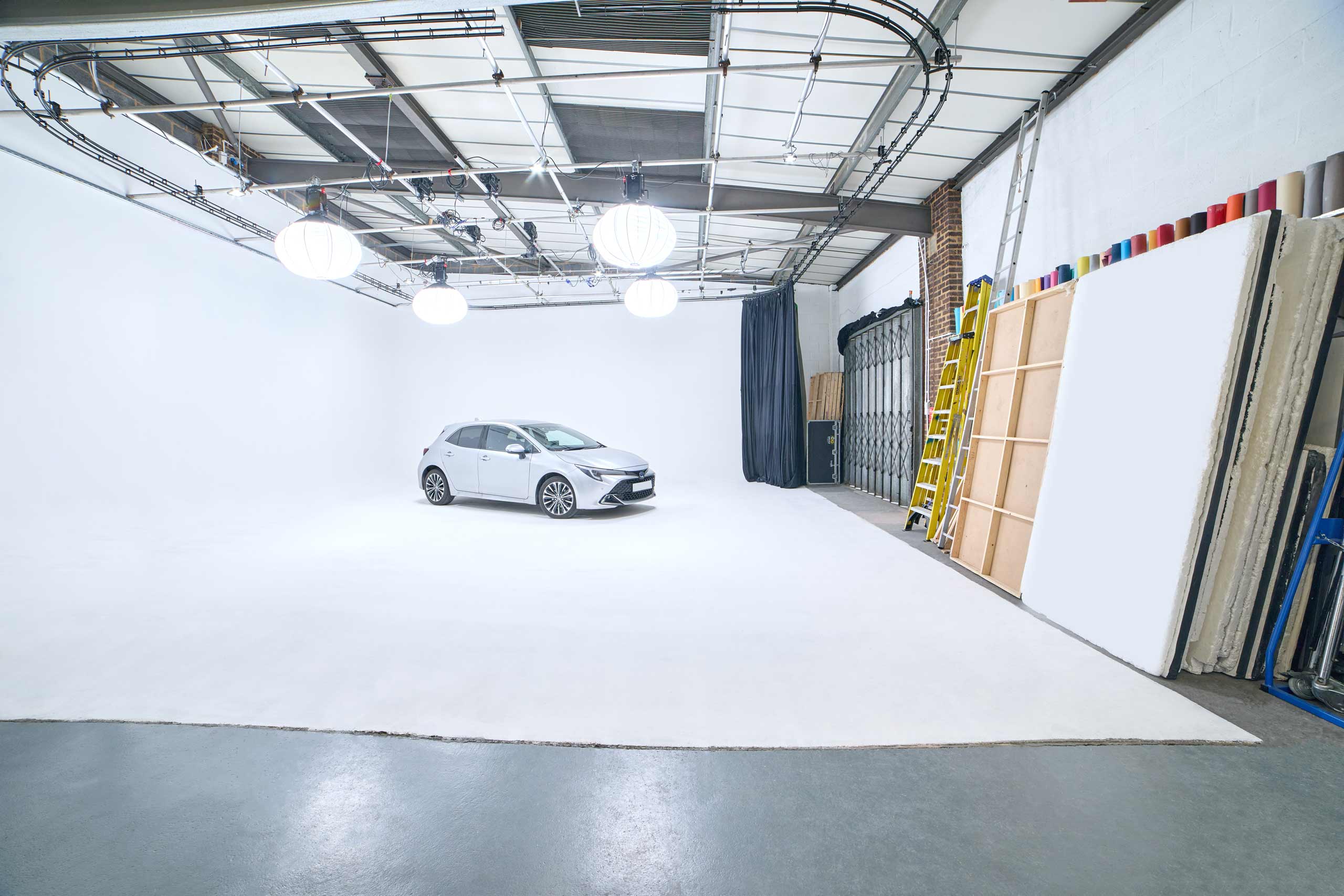 Versatile event space with white backdrop at Cineview Studios, ideal for product launches.