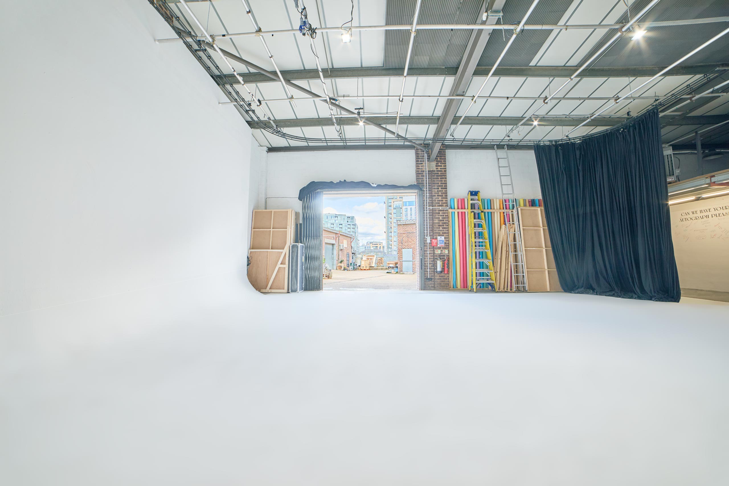 Versatile event space with white backdrop at Cineview Studios, ideal for corporate events.