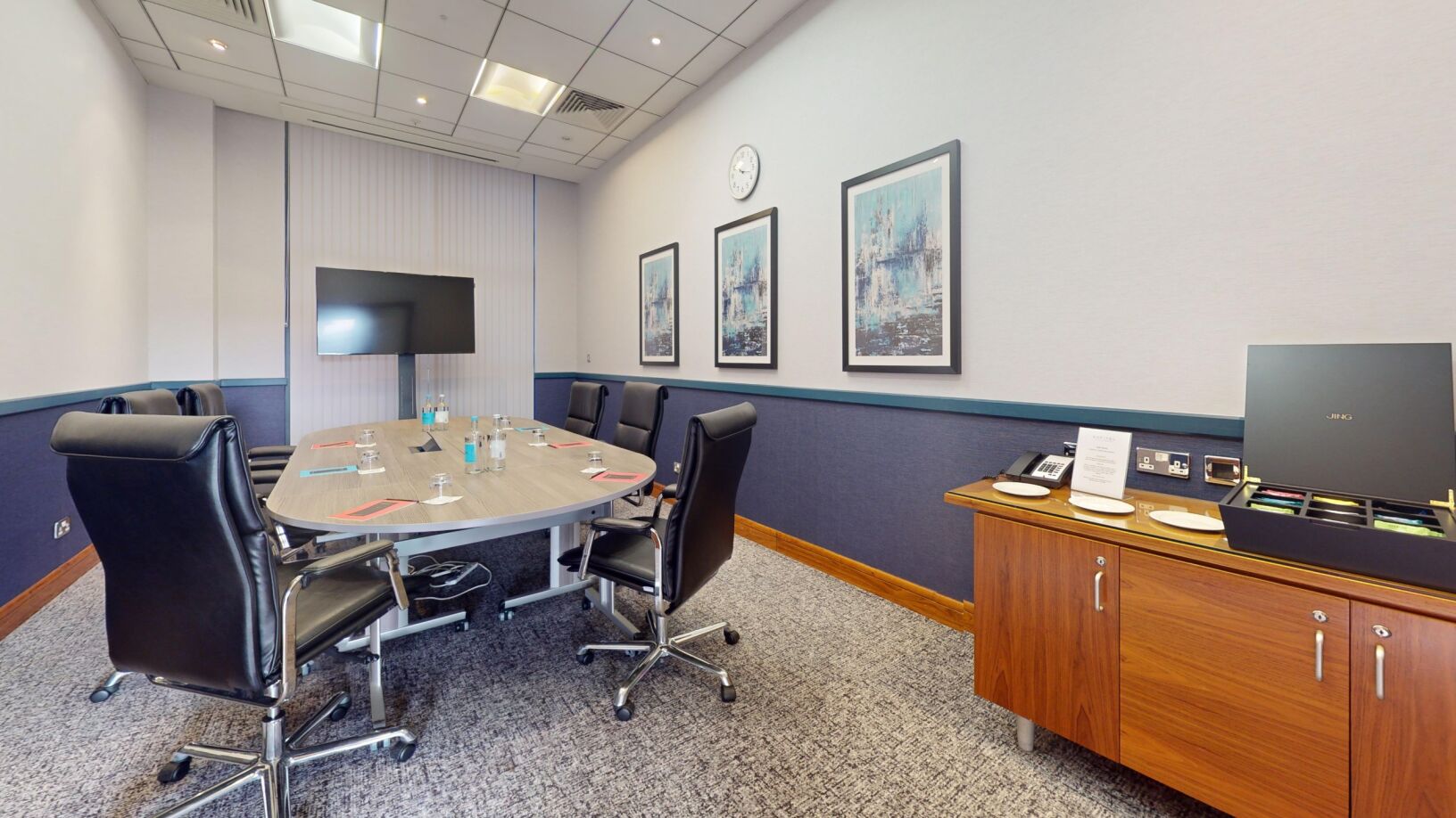 Meeting room at Sofitel London Gatwick with sleek table, ideal for conferences and events.