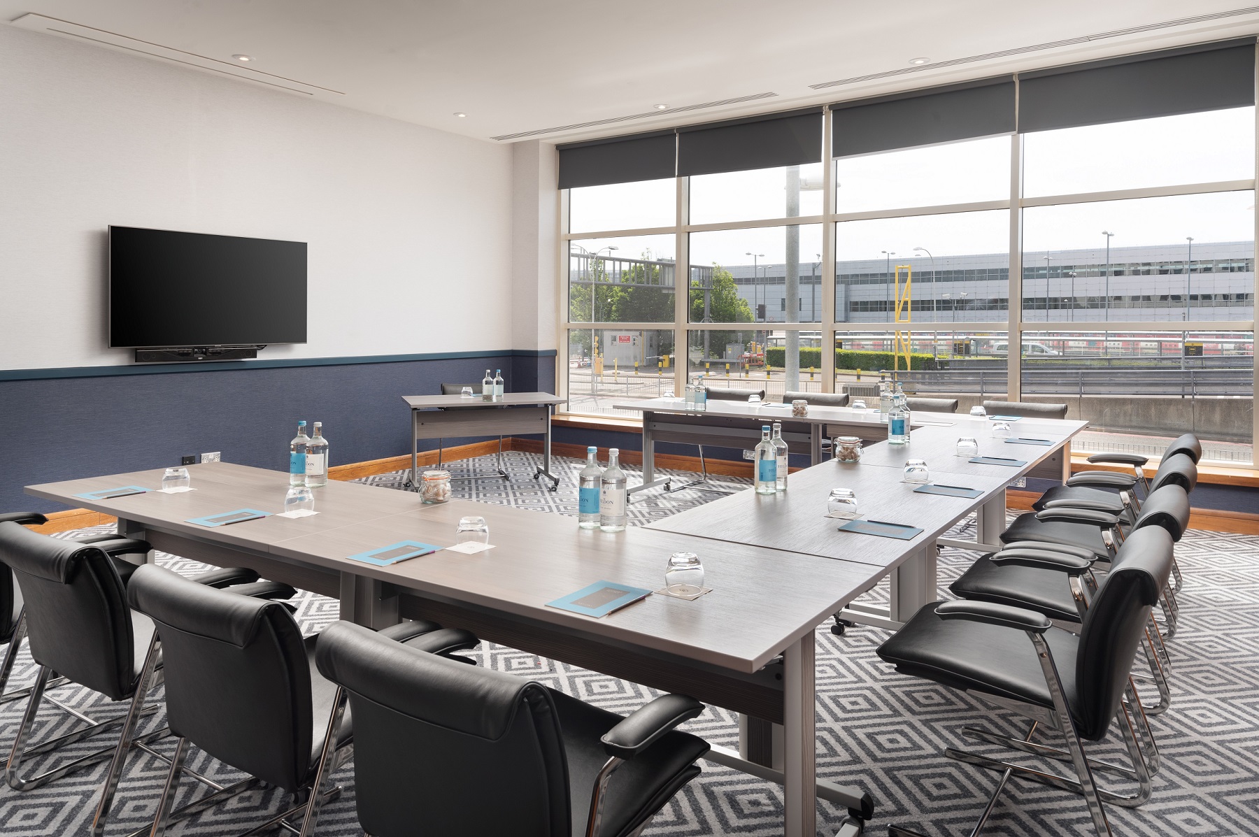 Modern meeting room at Sofitel London Gatwick with natural light for professional events.