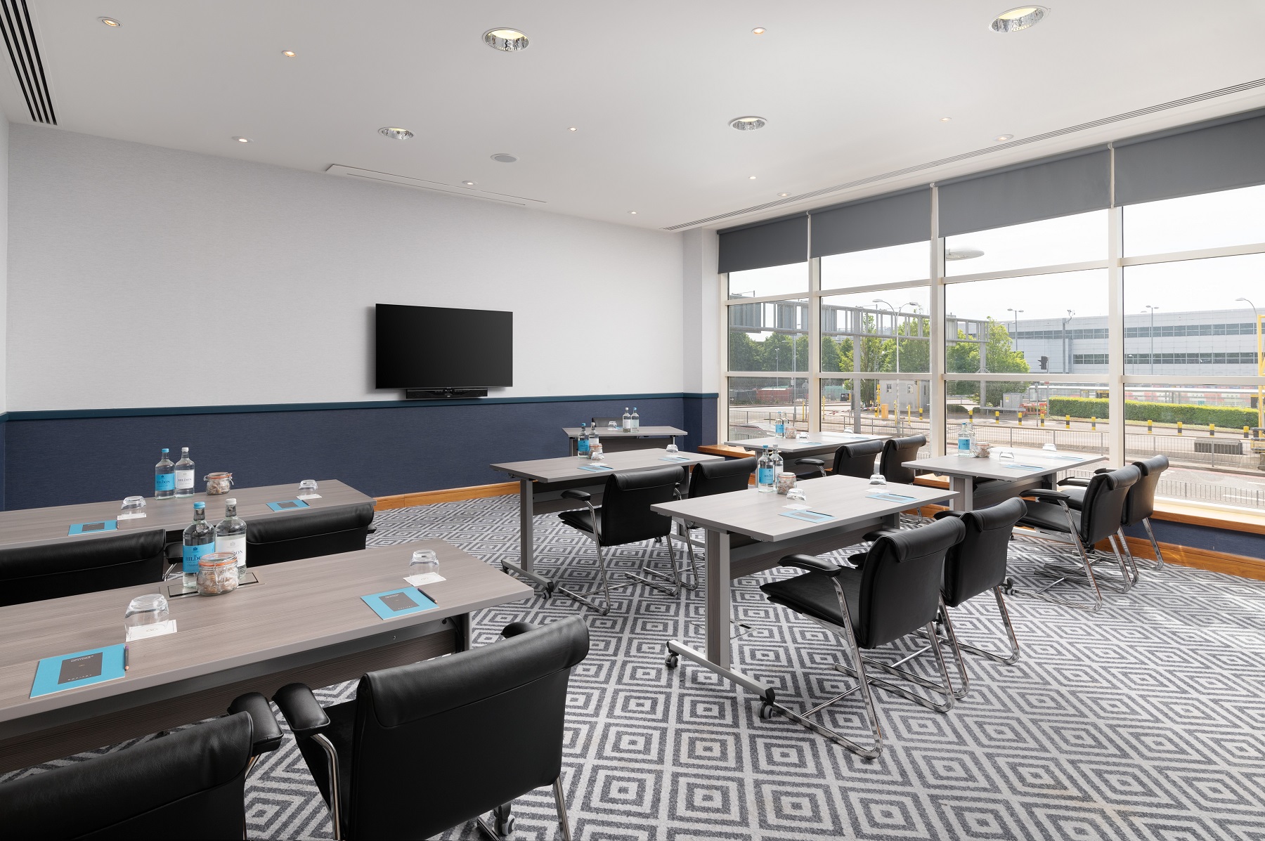 Meeting room at Sofitel London Gatwick with natural light, ideal for professional events.