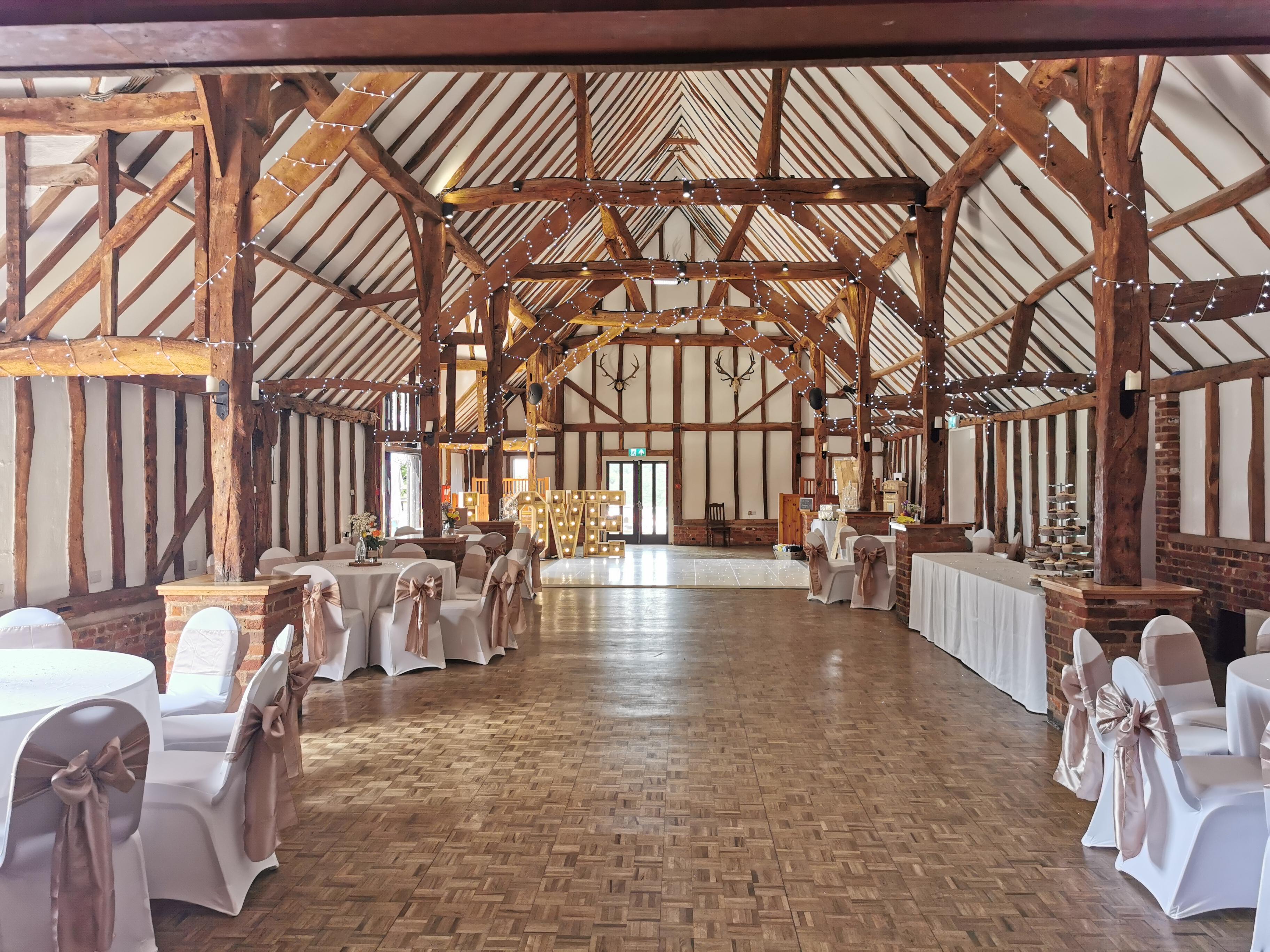 Lodge Barn at Knebworth House, featuring exposed beams, ideal for weddings and events.