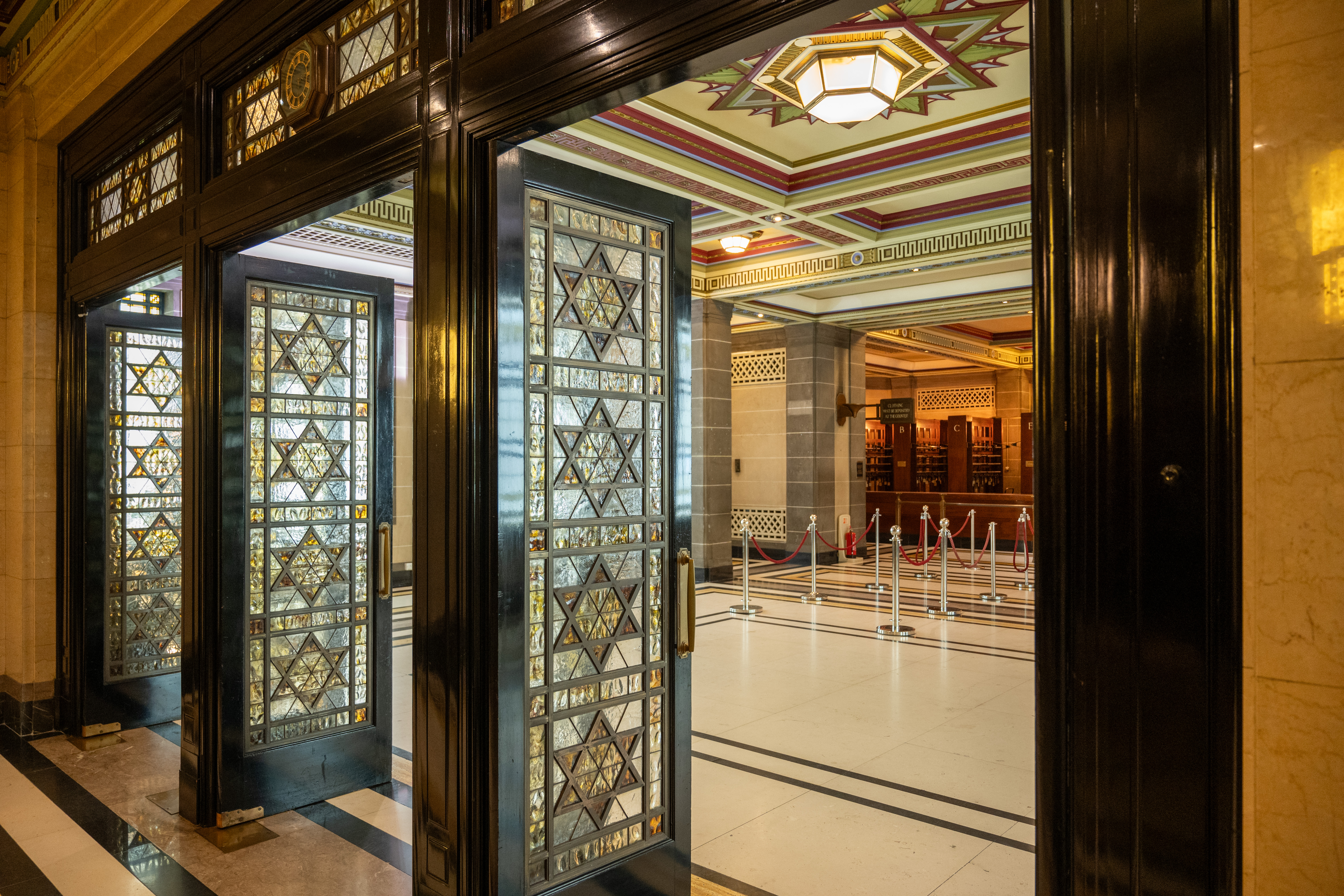Grand foyer with stained glass doors at Tower Doors, ideal for elegant events.