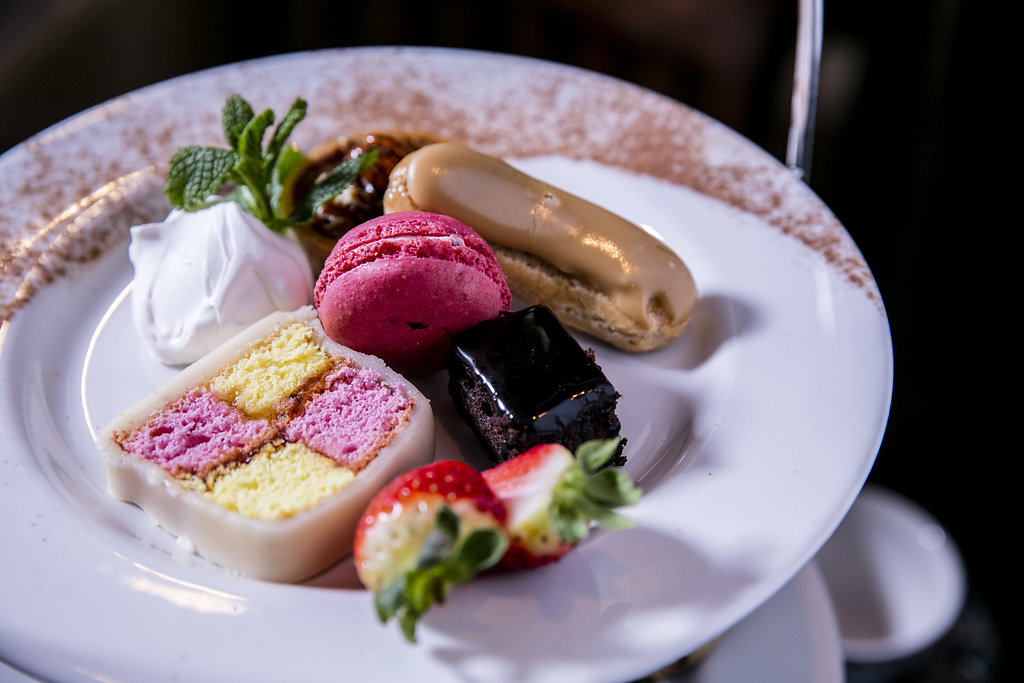 Elegant dessert plate with colorful macarons for upscale events in Covent Garden.