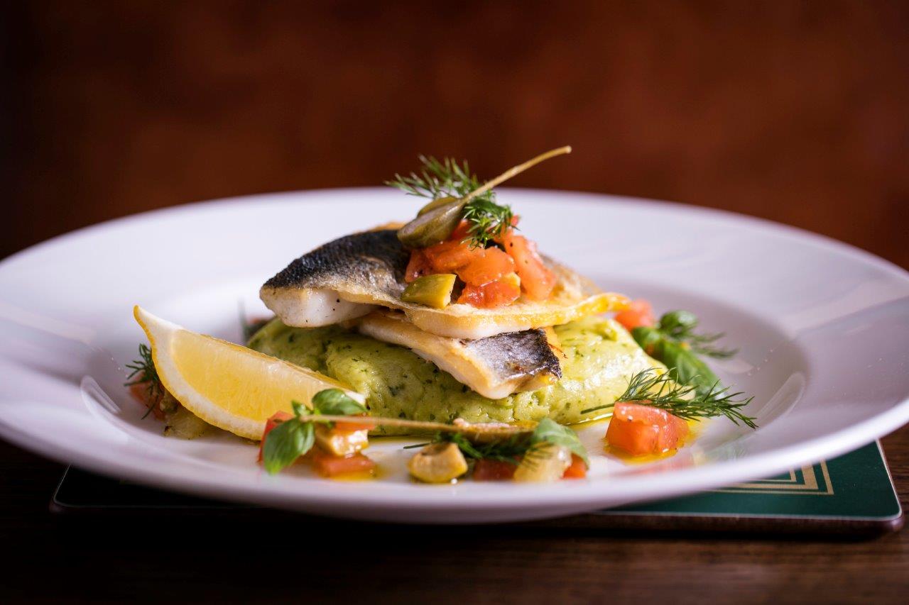 Plated fish dish with creamy sauce at Market Cellar, Covent Garden event dining.
