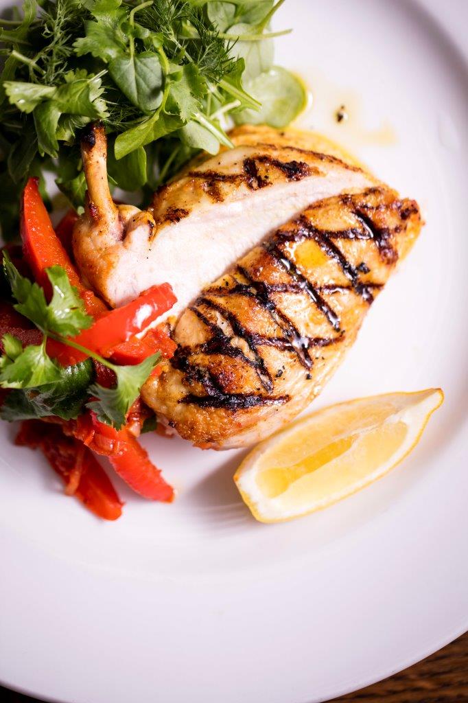 Grilled chicken breast with herbs and peppers at Banana Vault, Covent Garden event dining.