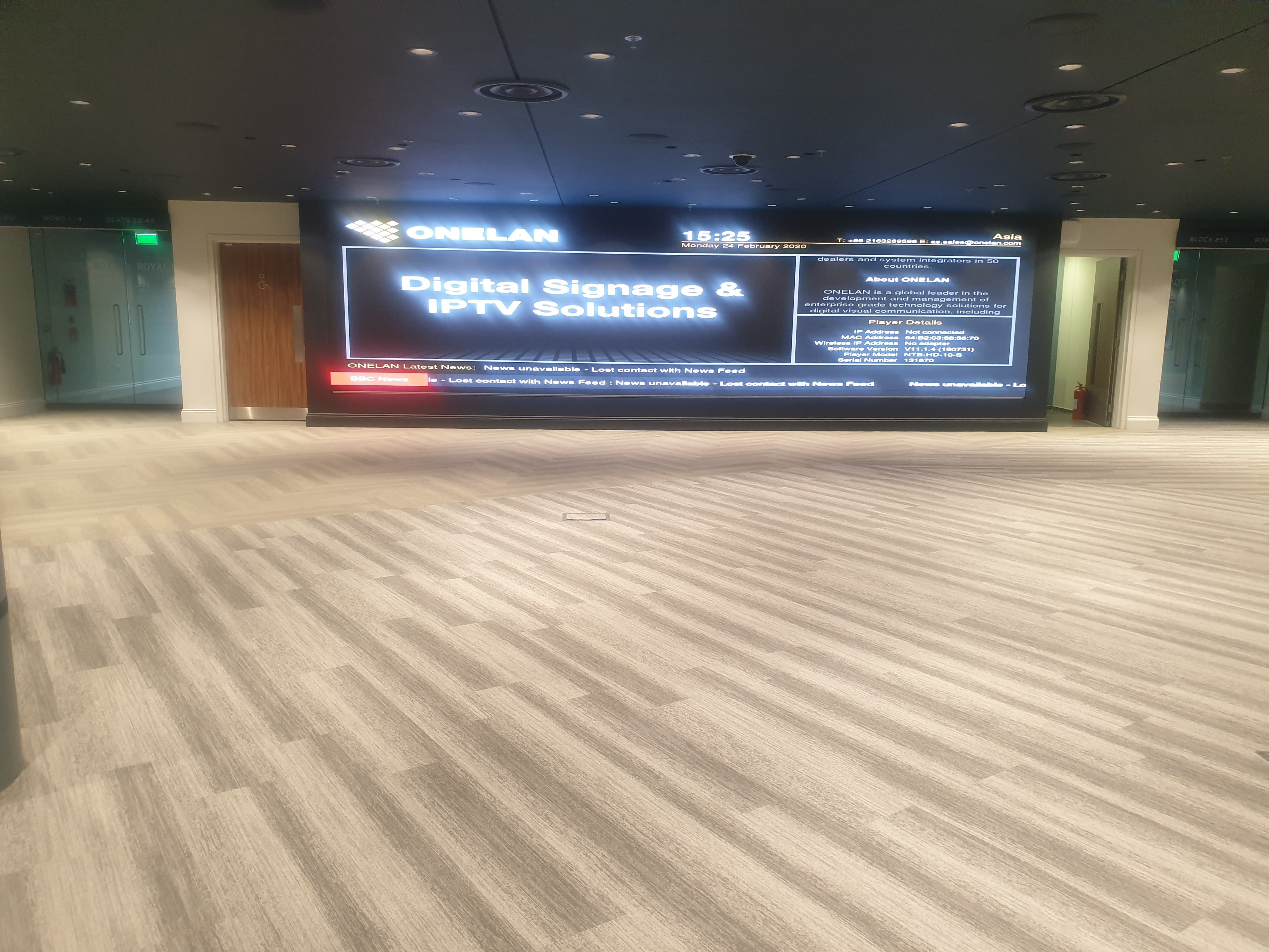 Wembley Suite foyer at Wembley Stadium with digital wall for corporate events and networking.