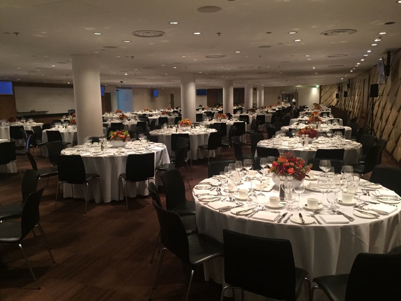 Wembley Suite banquet setup: round tables in a spacious corporate event venue for gala dinners.