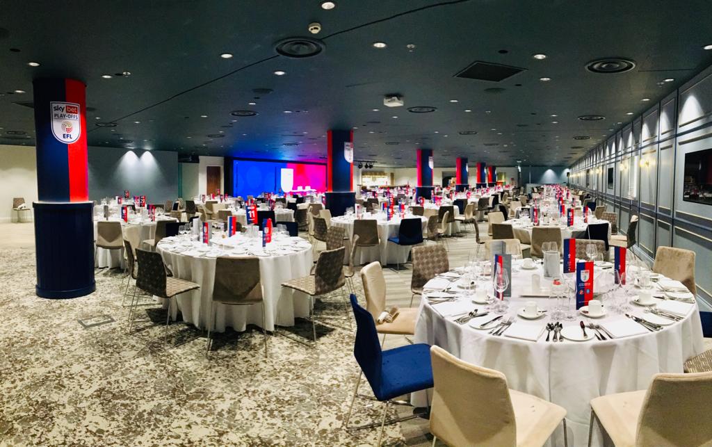 Wembley Suite event space with elegant tables, ideal for conferences and banquets.