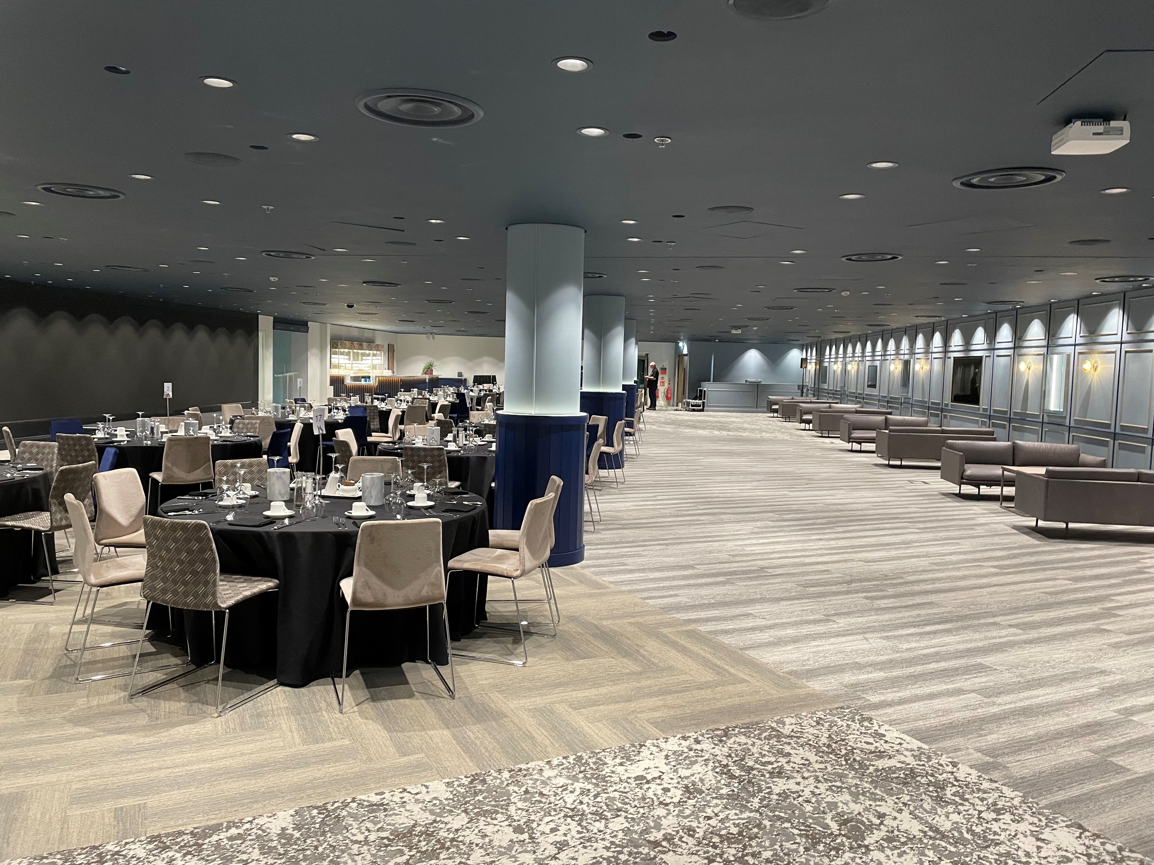 Wembley Suite at Wembley Stadium, elegant black and white setup for formal events.