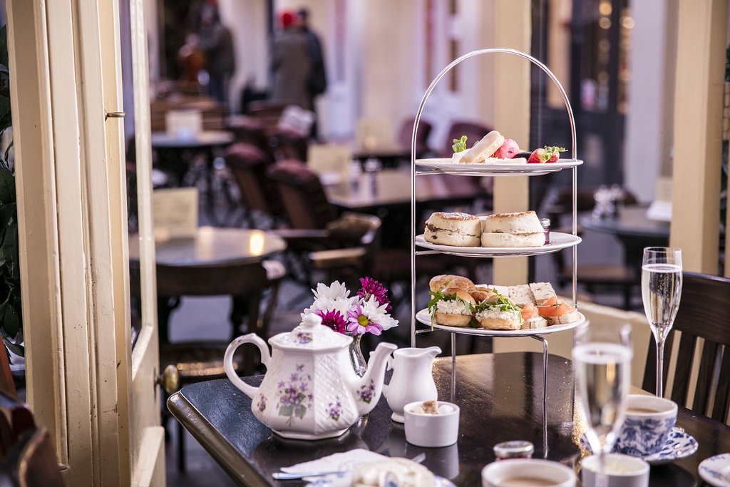 Elegant afternoon tea setup with pastries at Irish Whisky Vault, Covent Garden.
