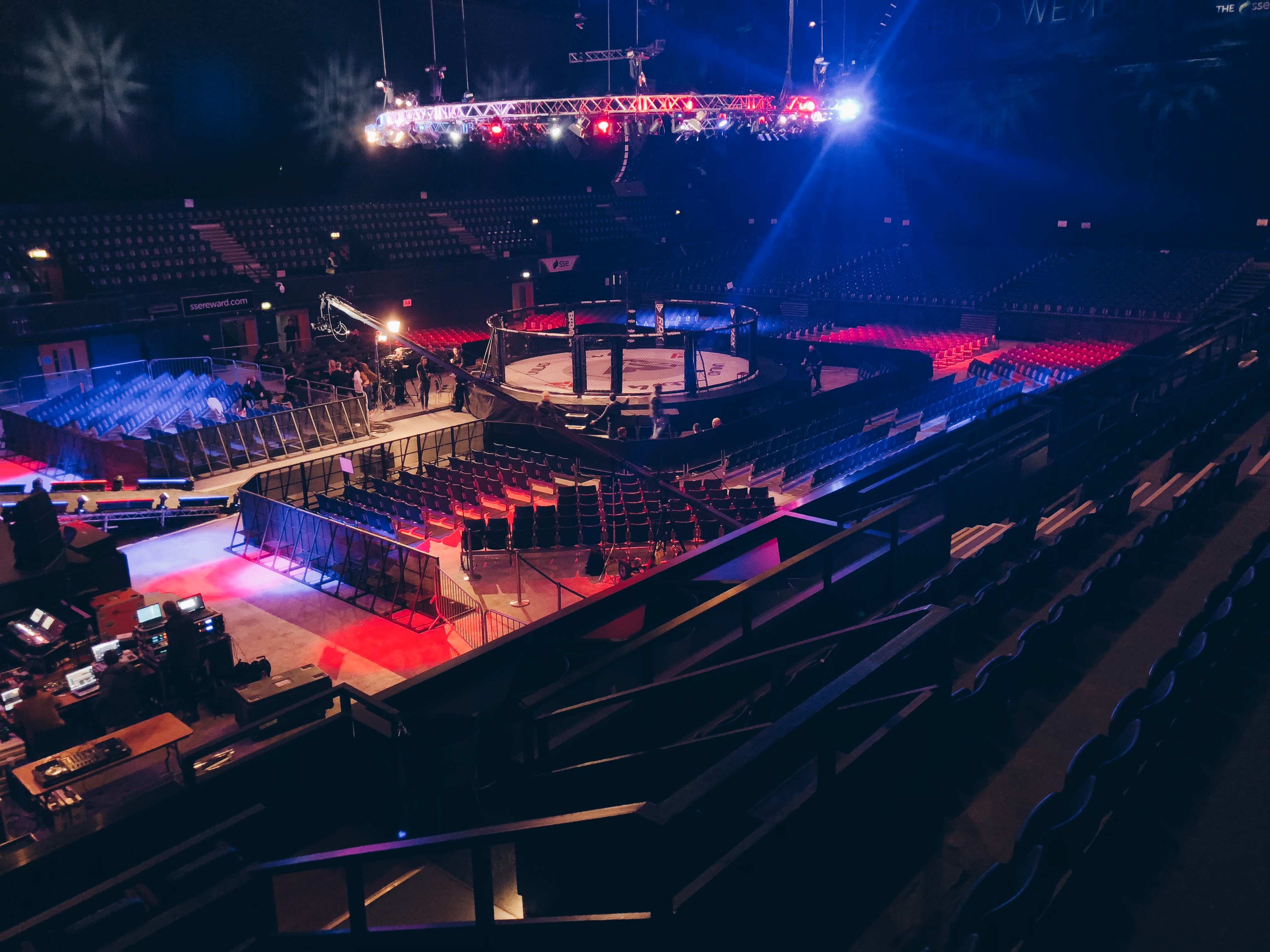 OVO Arena Wembley set for a combat sports event with an octagonal ring and tiered seating.