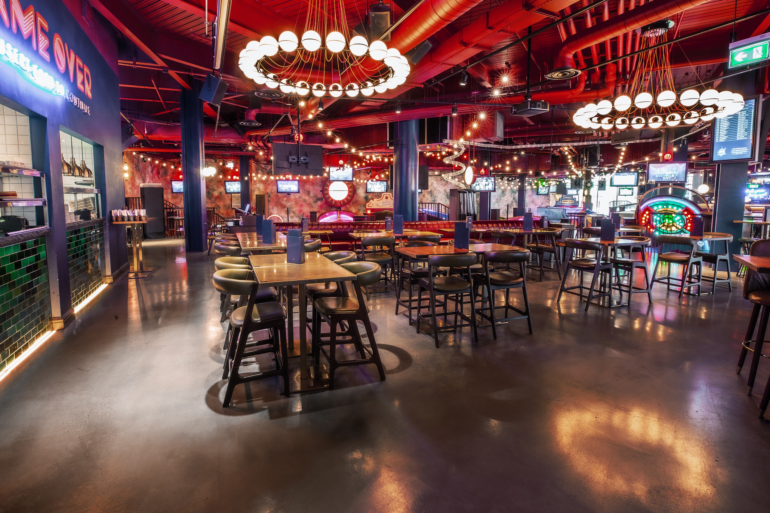 Vibrant Ruby Area at Puttshack White City, ideal for networking events and gatherings.