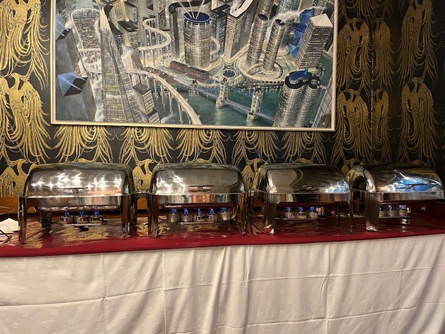 Buffet setup with chafing dishes at The Charter Gallery, ideal for elegant catering events.