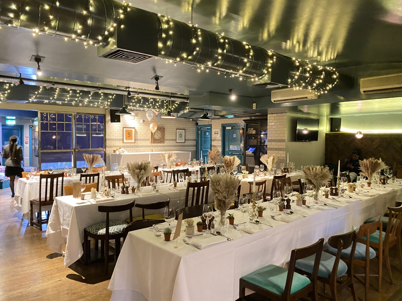 Elegant dining space at The Tokenhouse with white linens, perfect for intimate events.