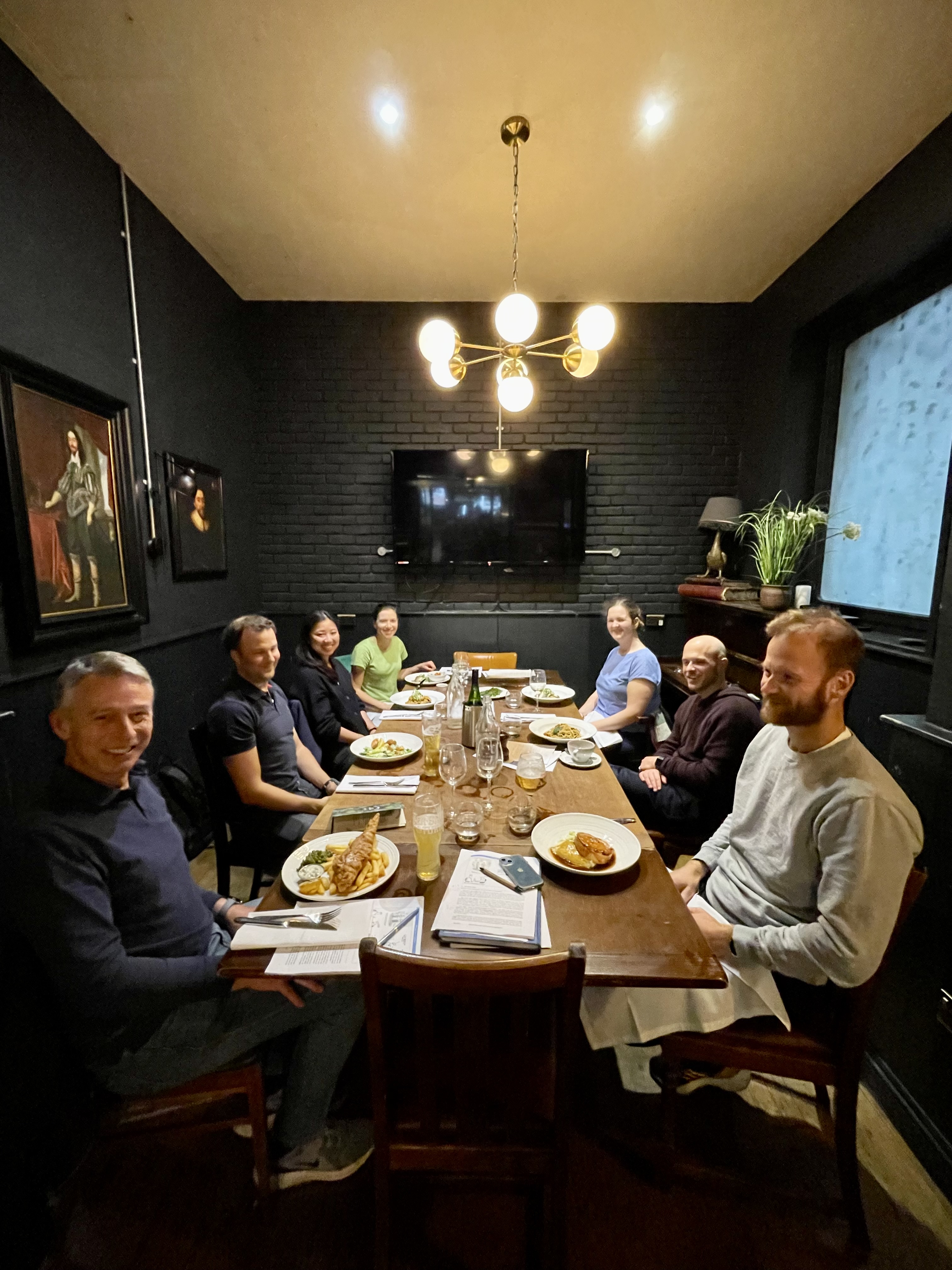 Cozy dinner meeting at The Tokenhouse Main Bar with warm lighting and inviting decor.