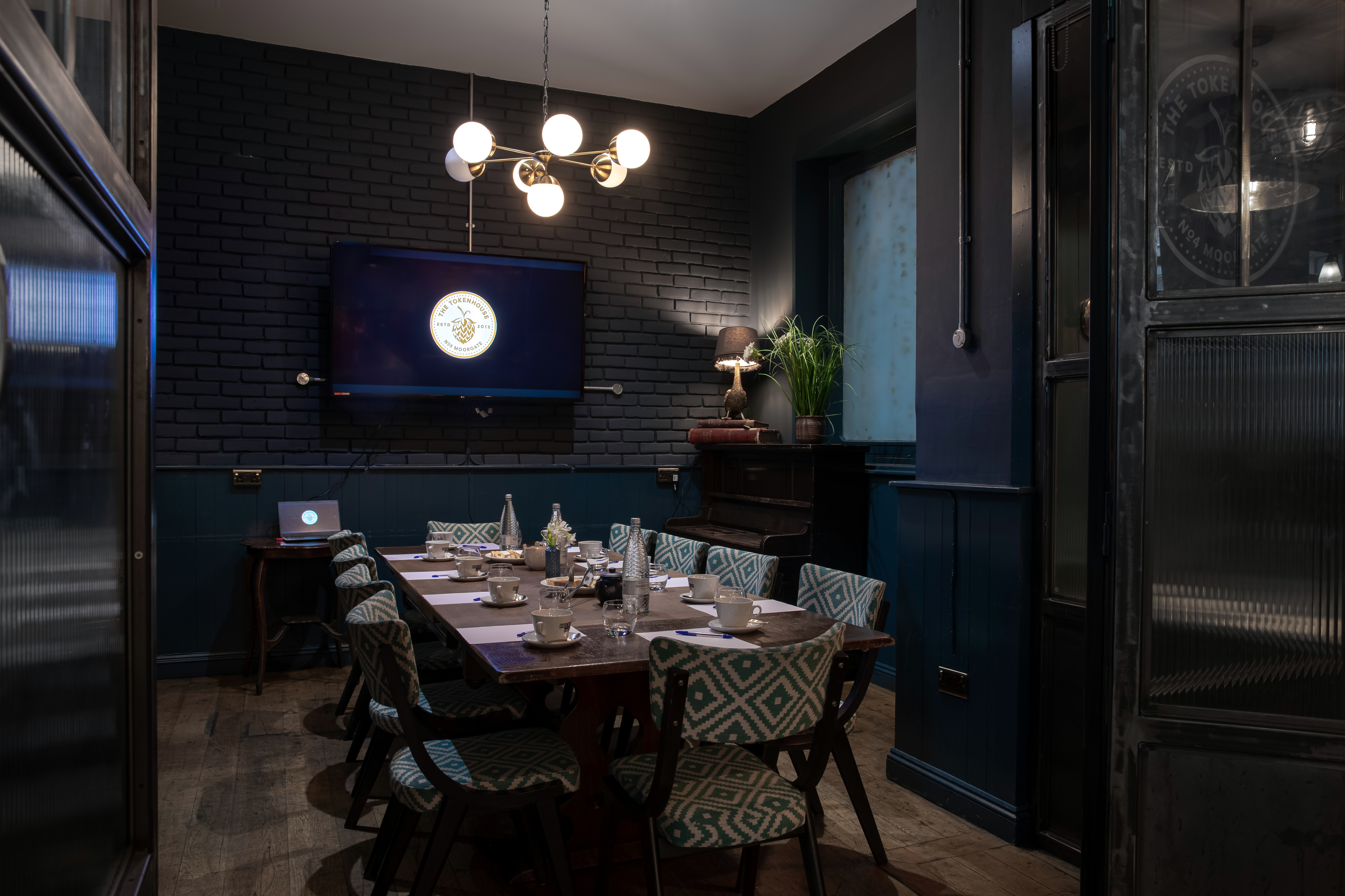Stylish meeting room at The Tokenhouse with modern lighting for conferences and gatherings.