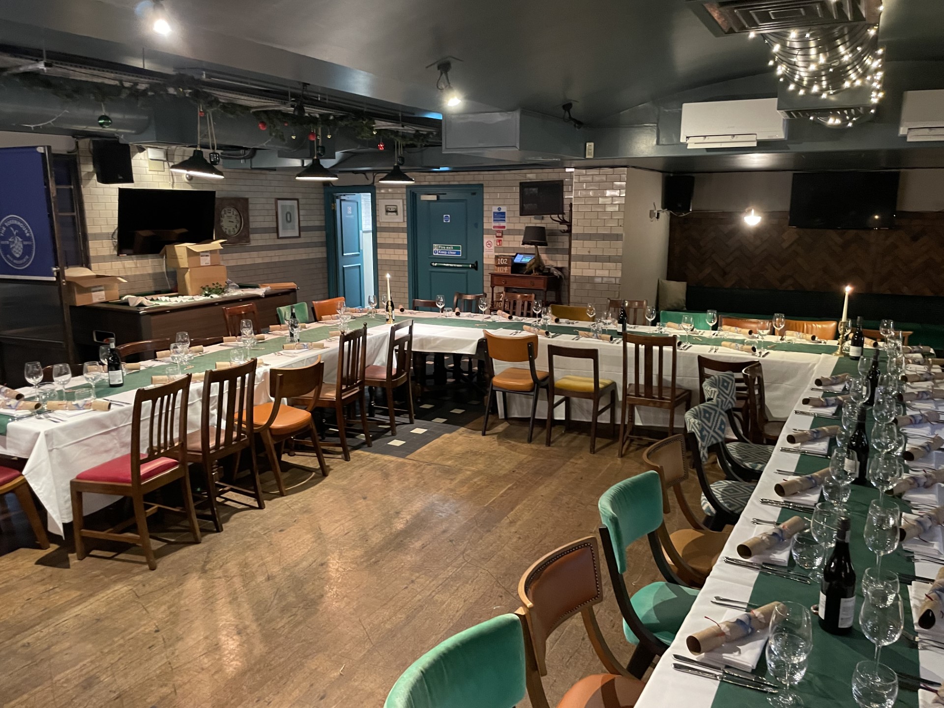 Cellar Bar dining setup with long table, ideal for corporate events and intimate gatherings.