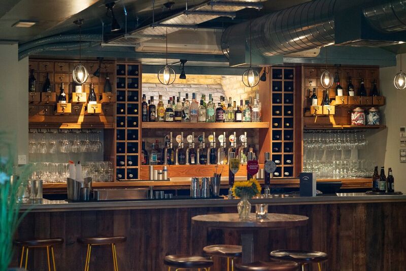 Cellar Bar at The Tokenhouse: inviting wood accents for networking events and gatherings.
