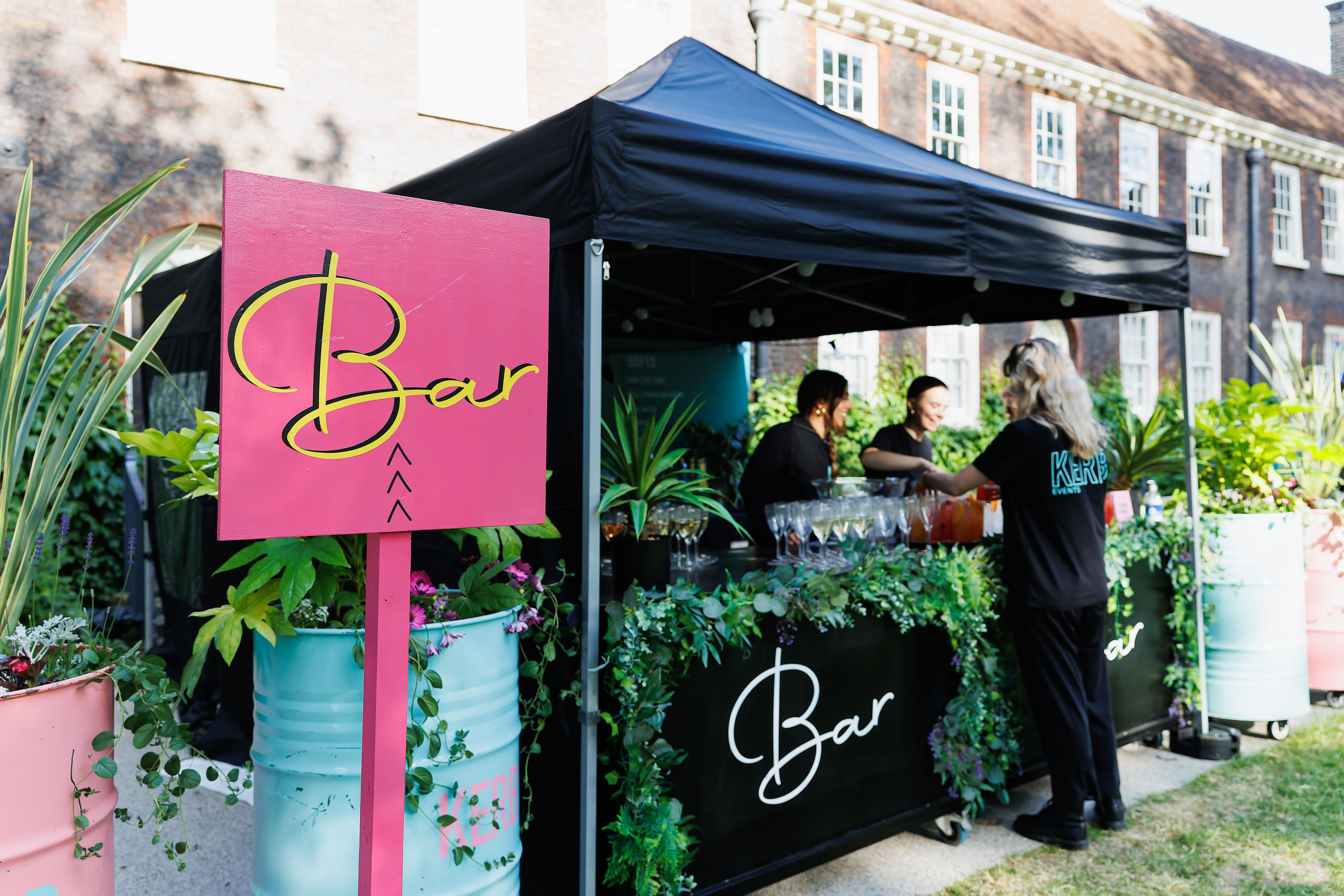 Vibrant outdoor bar at The Lawns, Shoreditch Gardens for social events and gatherings.