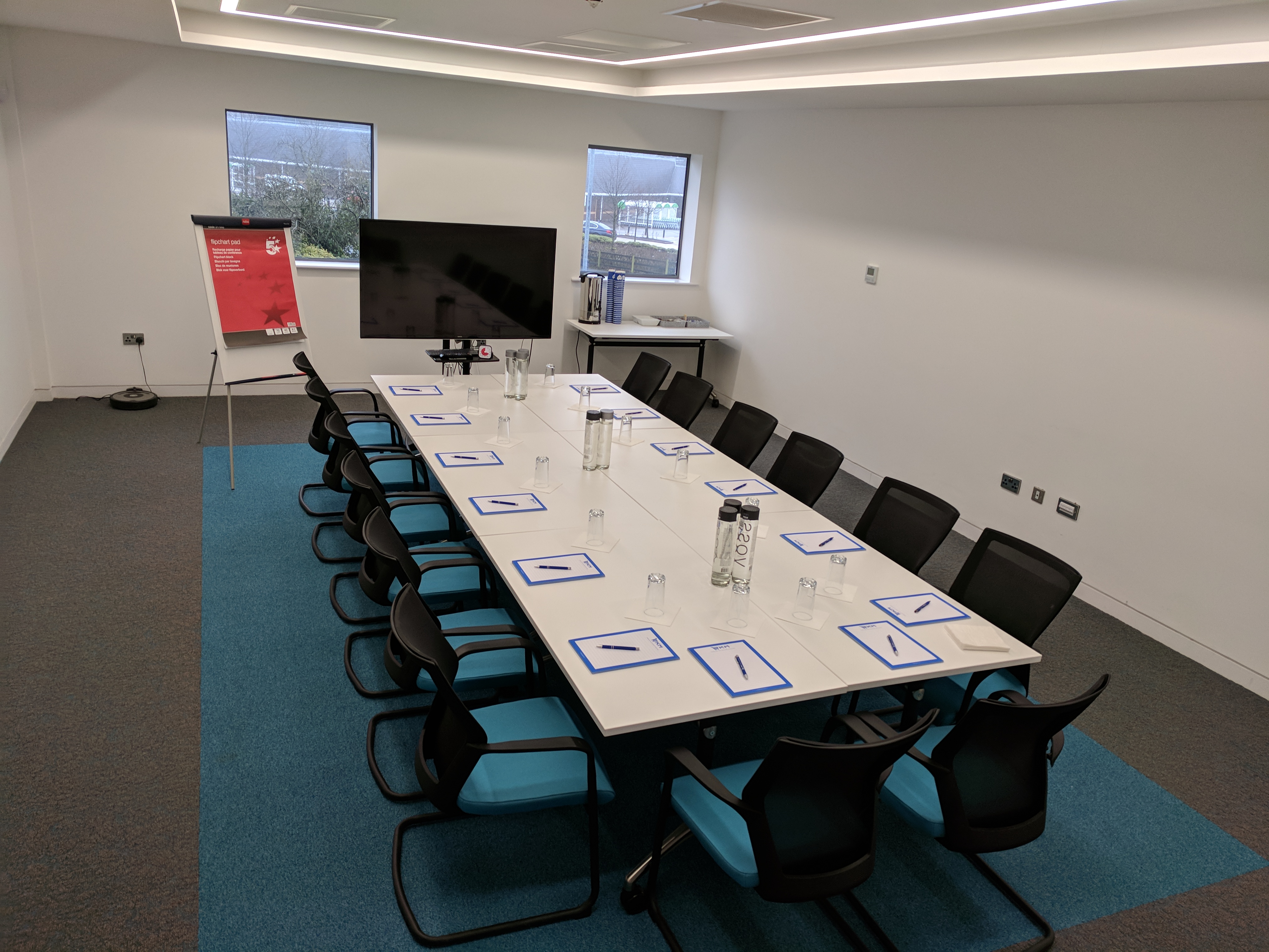 Board Room in EKM with long table, ideal for meetings and brainstorming sessions.