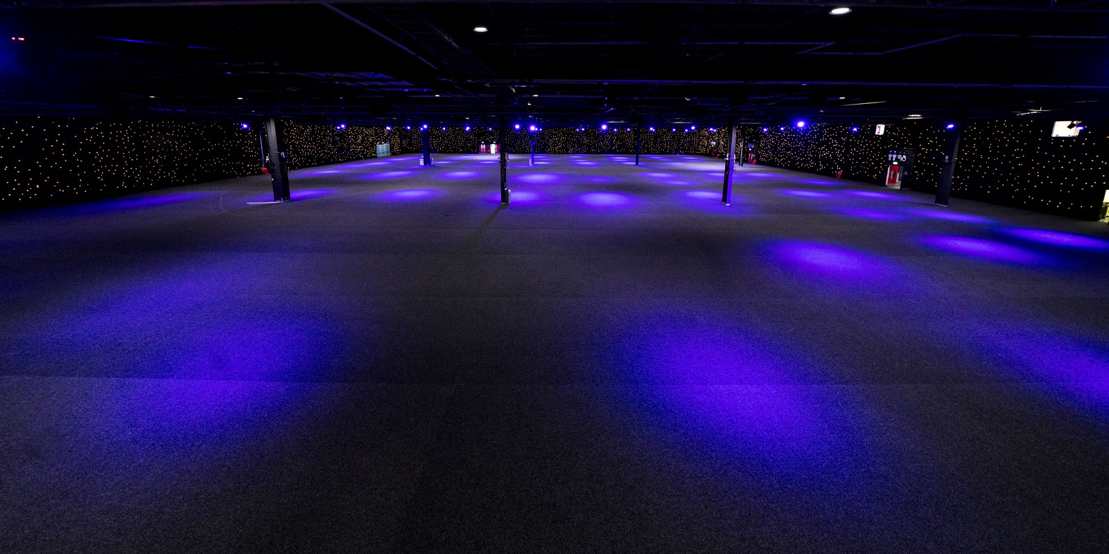 Spacious Hall 4 at EventCity with purple lighting for versatile events and gatherings.