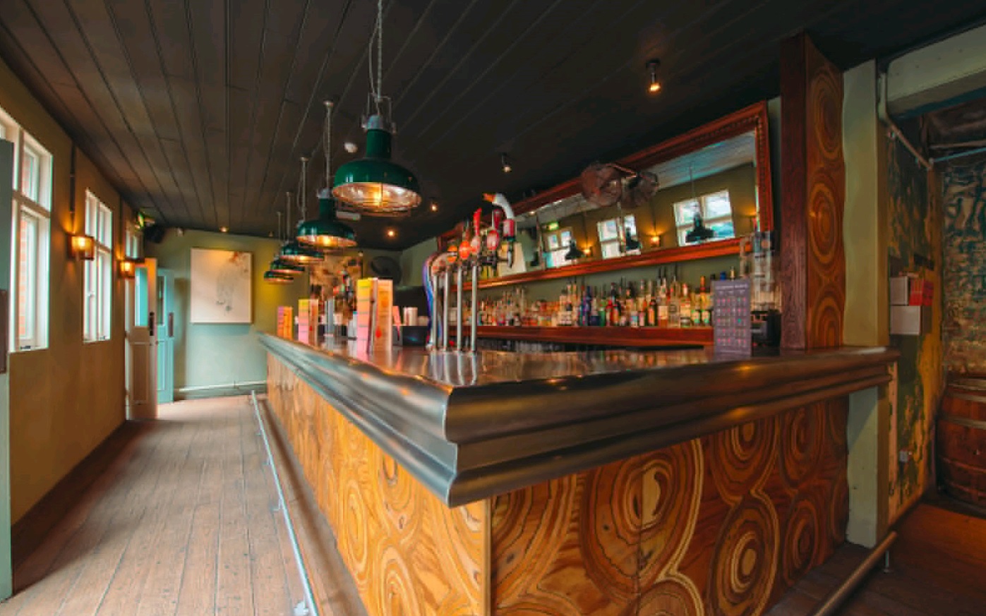 Stylish bar area in Revolution Brighton, ideal for networking events and casual gatherings.