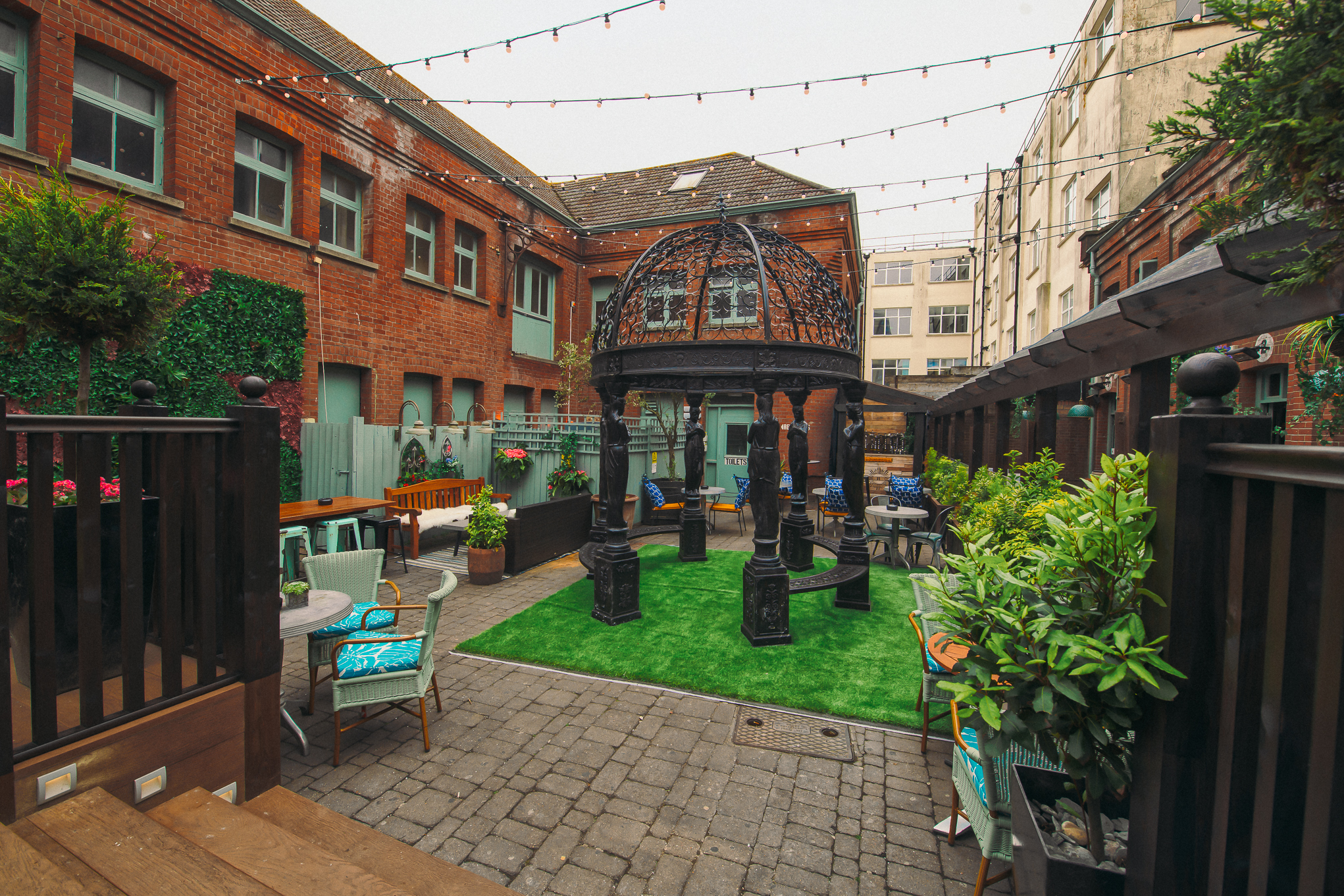 Charming outdoor venue with gazebo for events in Revolution Brighton, ideal for gatherings.