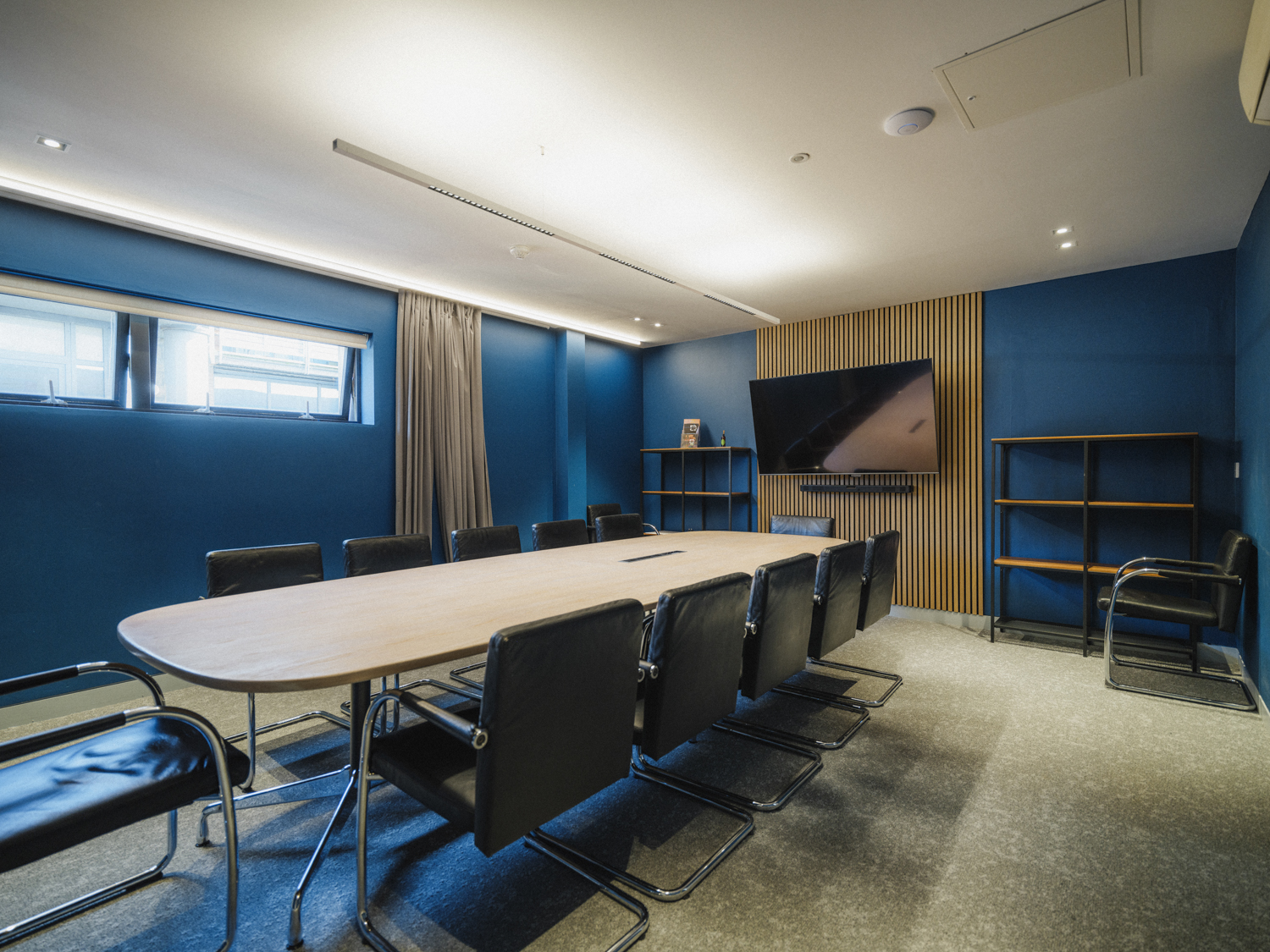 Modern conference room with oval table, ideal for meetings in FACT Liverpool.