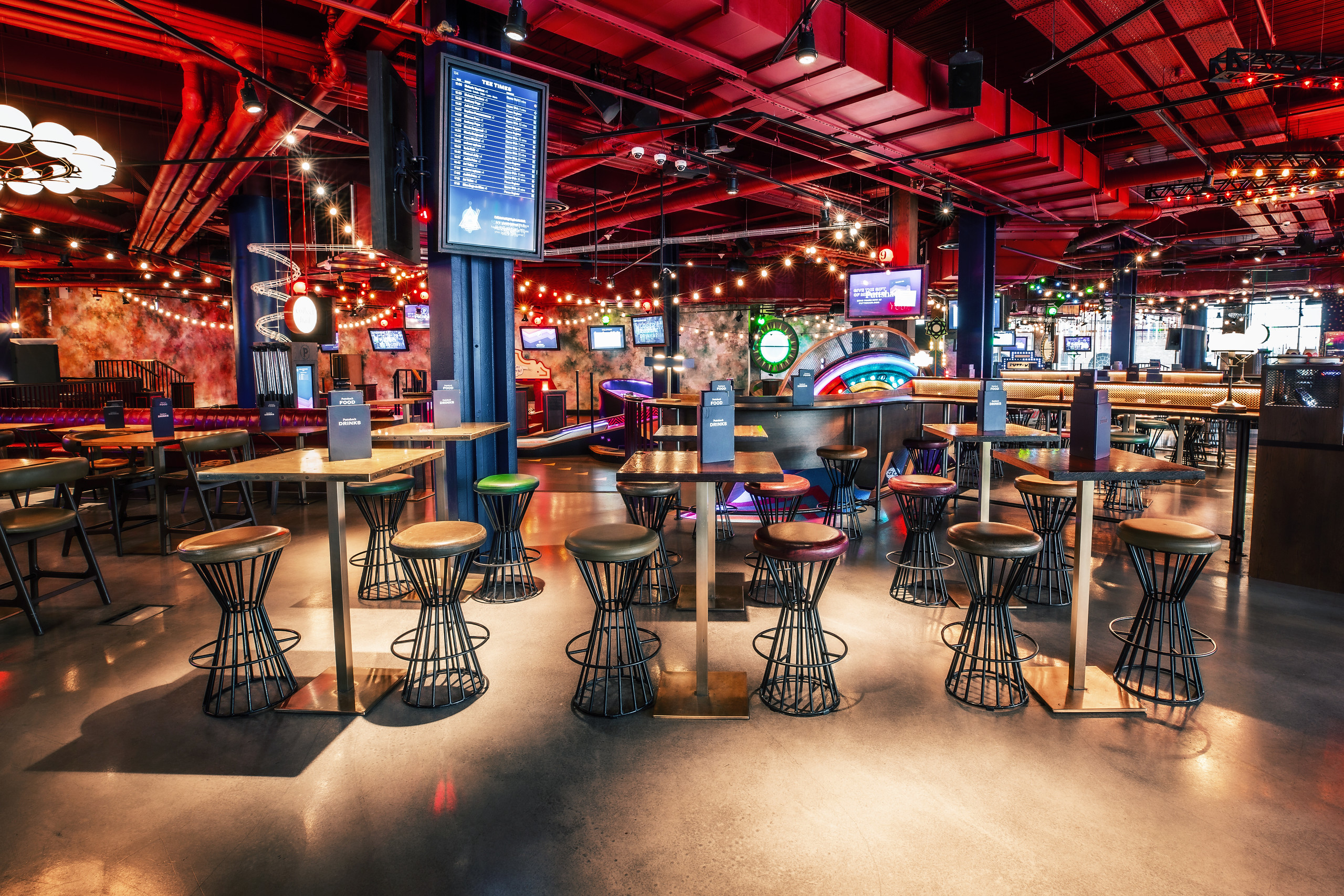 Vibrant event space at Puttshack White City for casual gatherings and team-building.