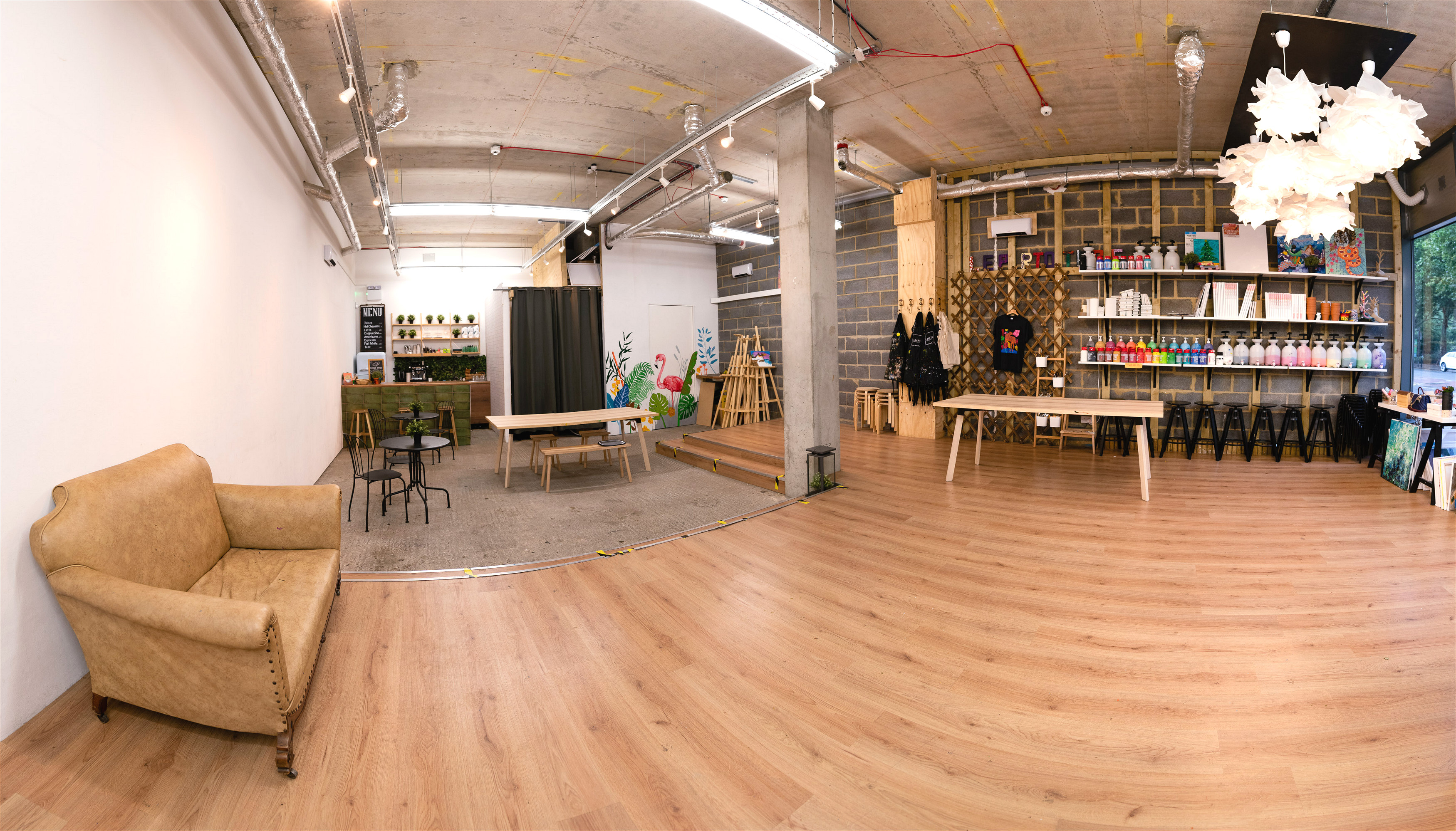 Versatile event space in Studio 249 with warm wood floors for meetings and workshops.