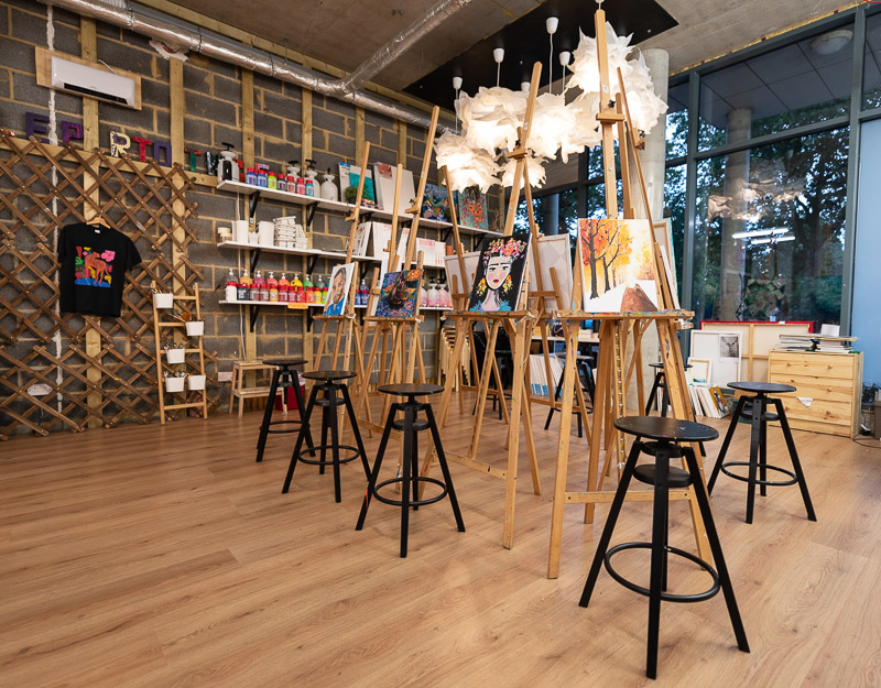 Creative event space in Studio 249 with easels for art workshops and team-building activities.