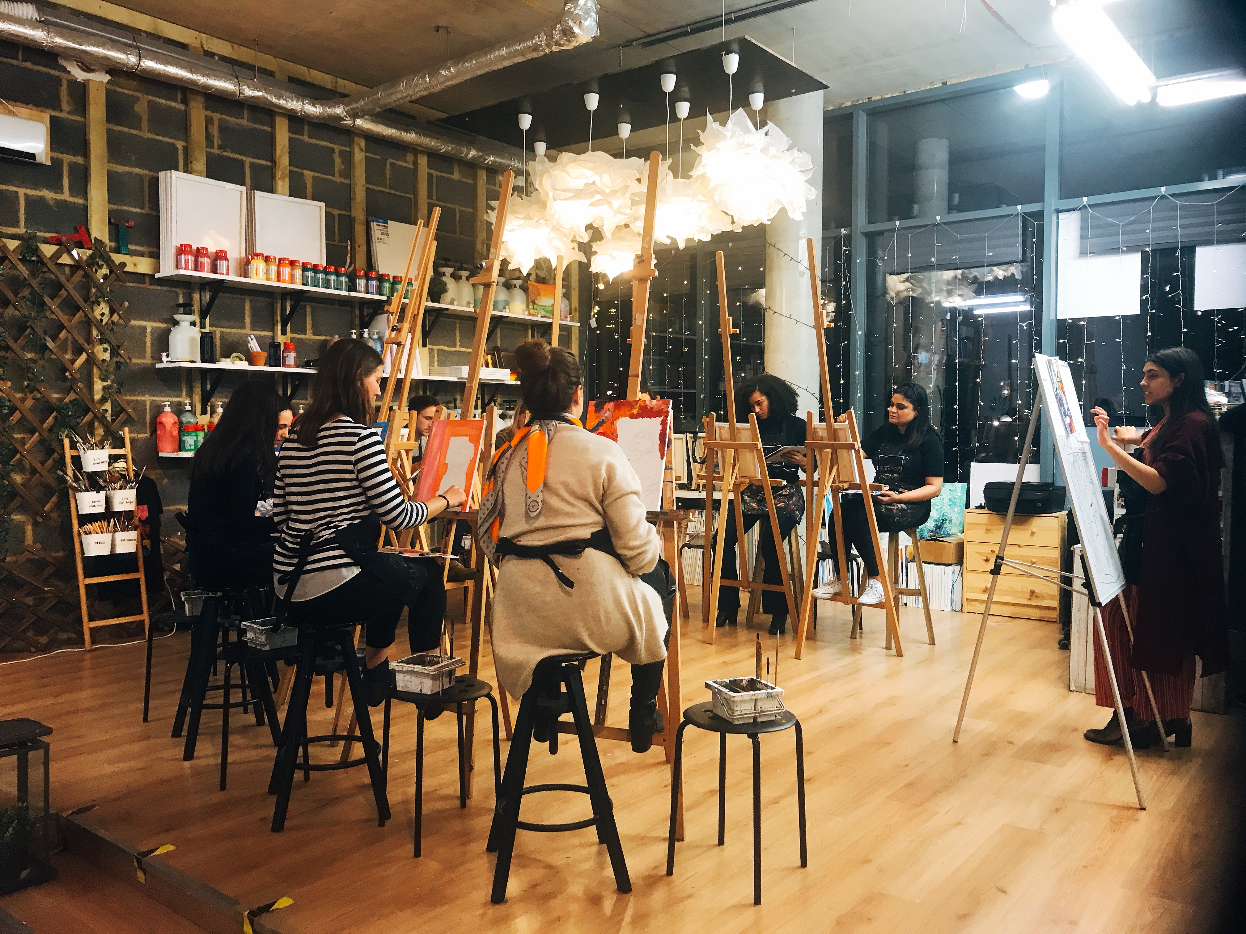 Creative workshop in Studio 249 with warm lighting for team-building events.