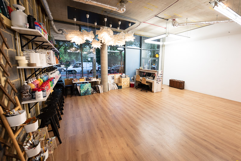 Versatile event space in Studio 249 with natural light, ideal for workshops and gatherings.