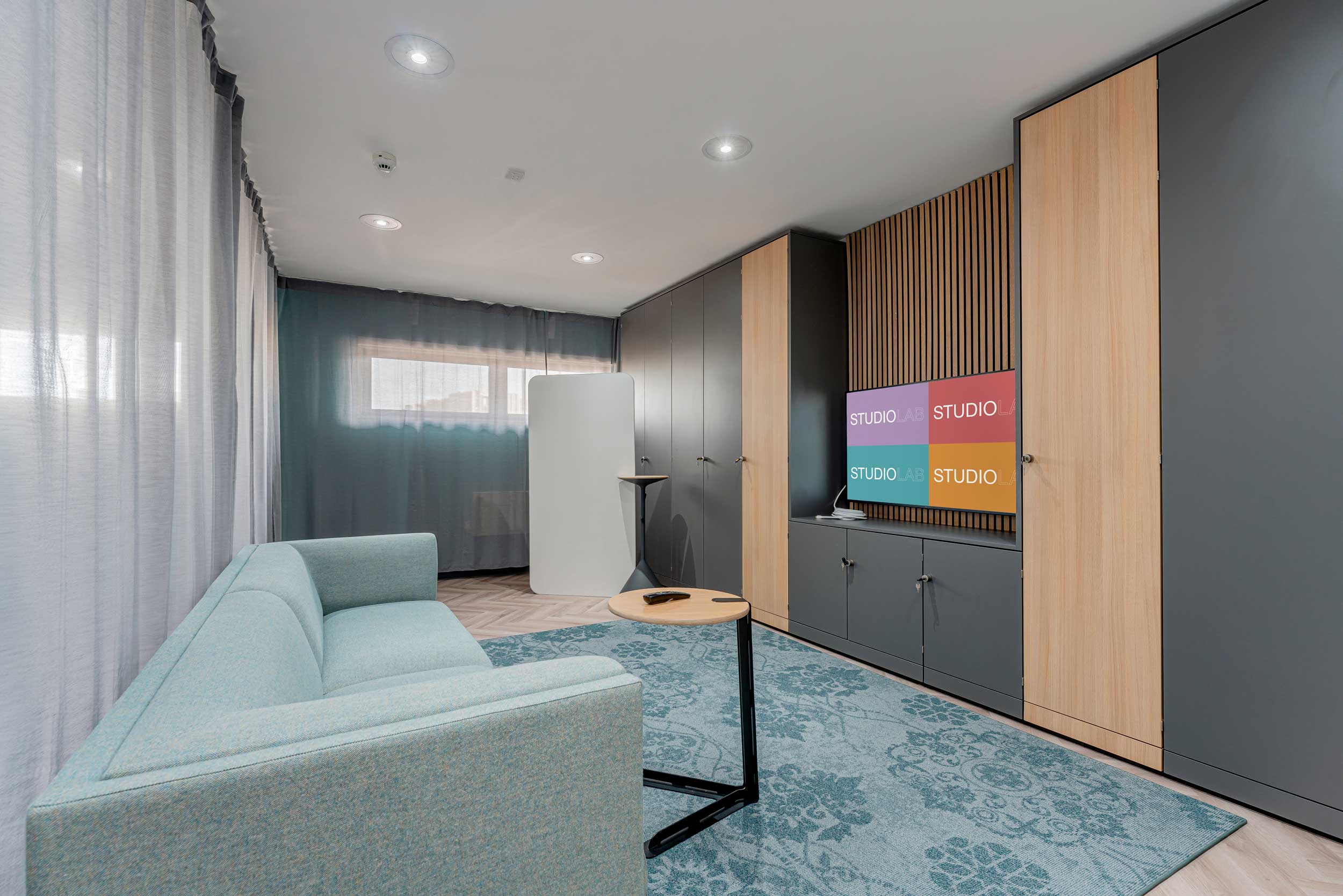 Modern multifunctional meeting space in FACT Liverpool for creative collaboration and brainstorming.