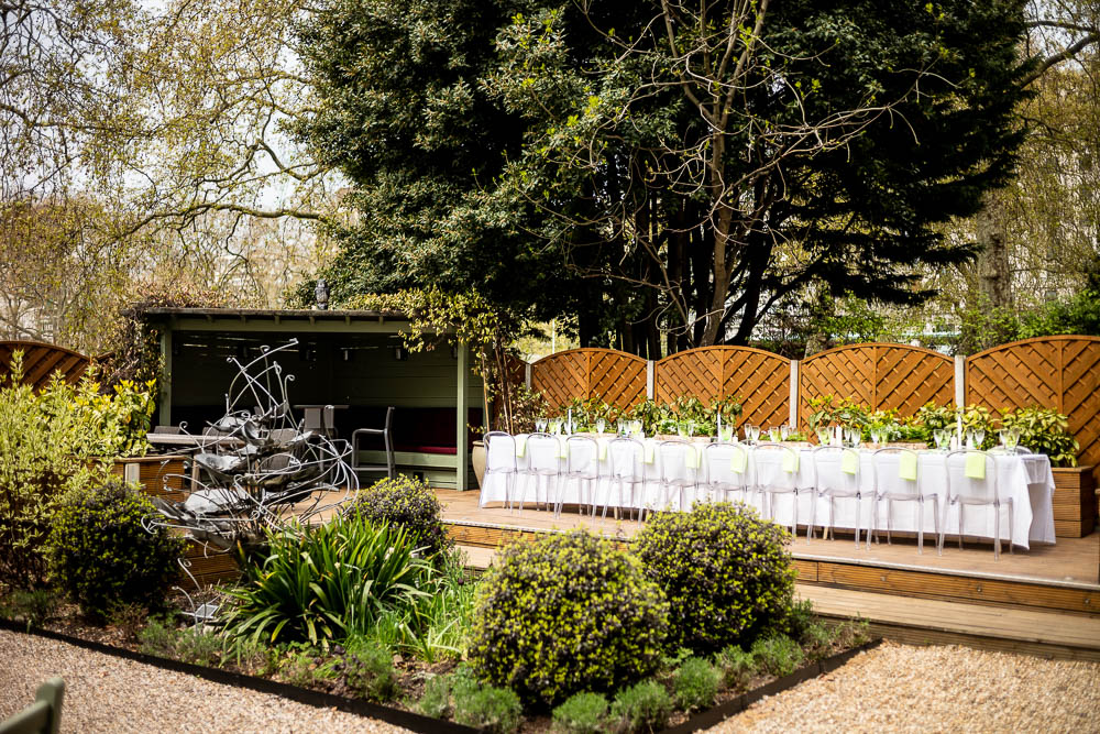 Elegant outdoor wedding venue with floral centerpieces at Six Park Place.