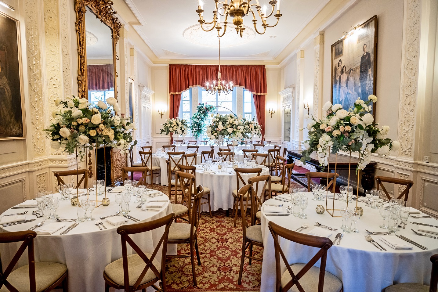 Elegant wedding venue with round tables and floral centerpieces at Six Park Place.