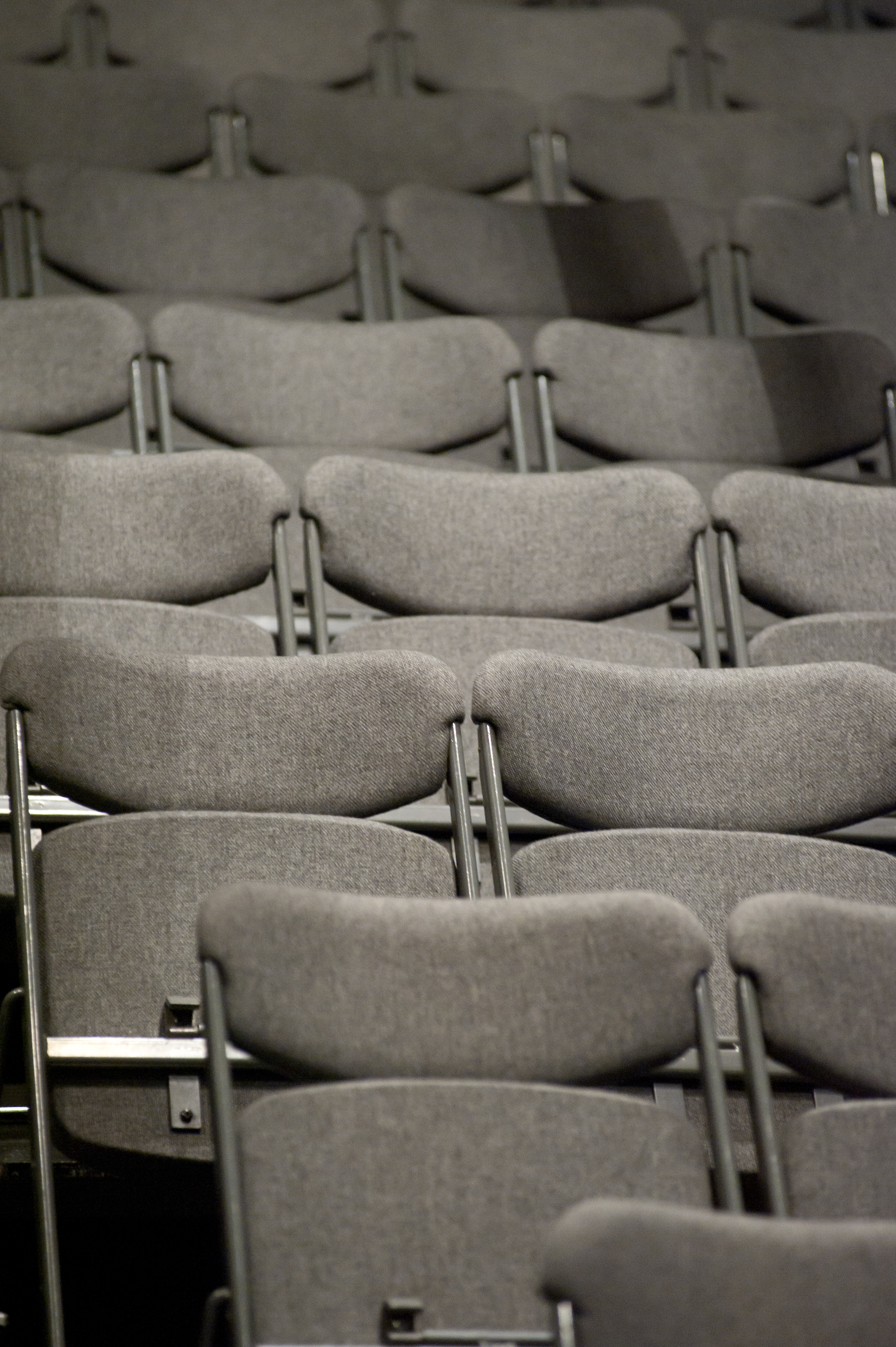 Bridewell Theatre gray chairs for conferences and seminars, promoting comfort and engagement.