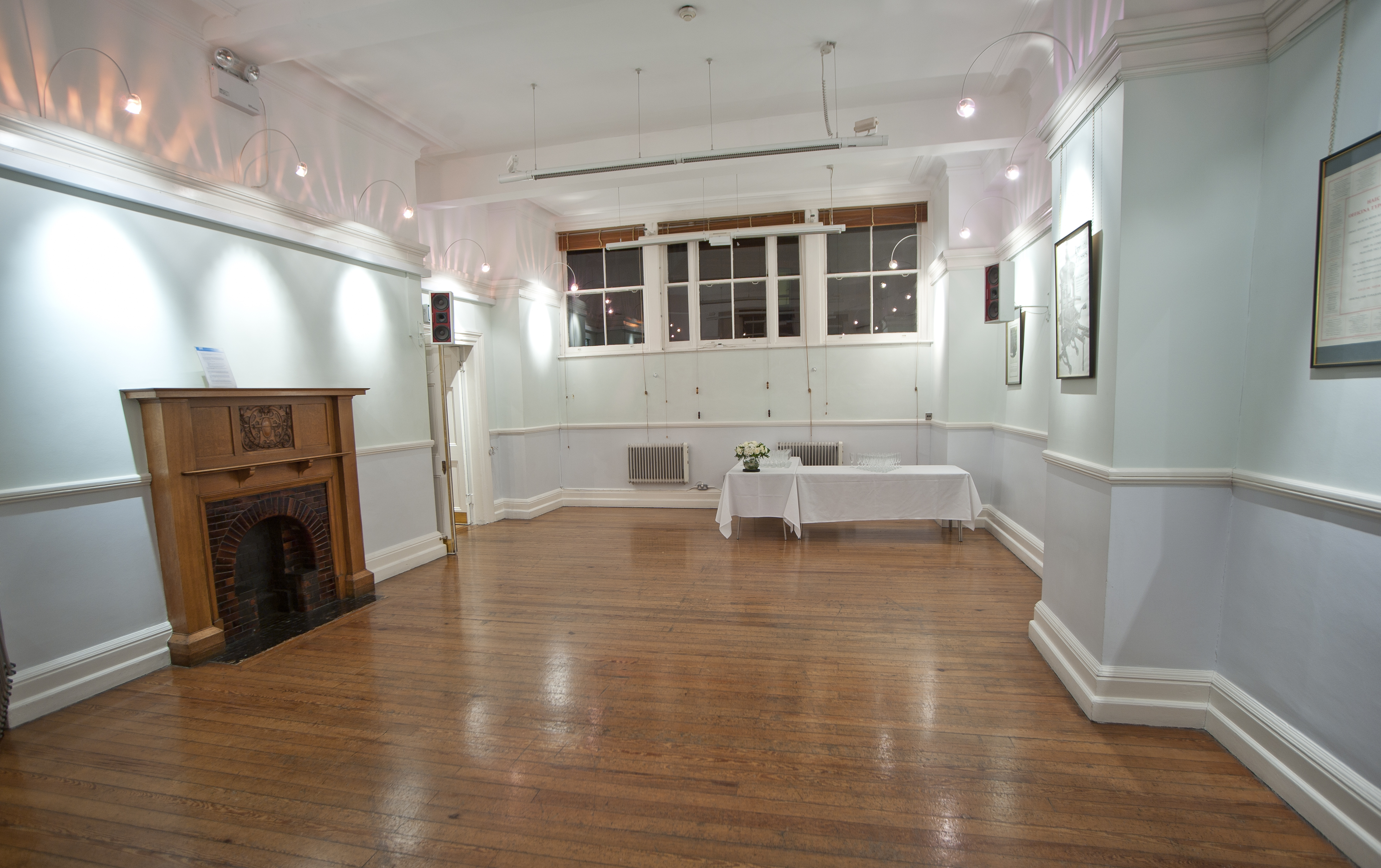"Versatile Bridewell Hall event space with polished wooden floors for gatherings and meetings."