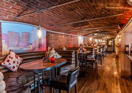 Cozy Sky Level venue at Revolution Albert Dock, perfect for intimate gatherings and networking.