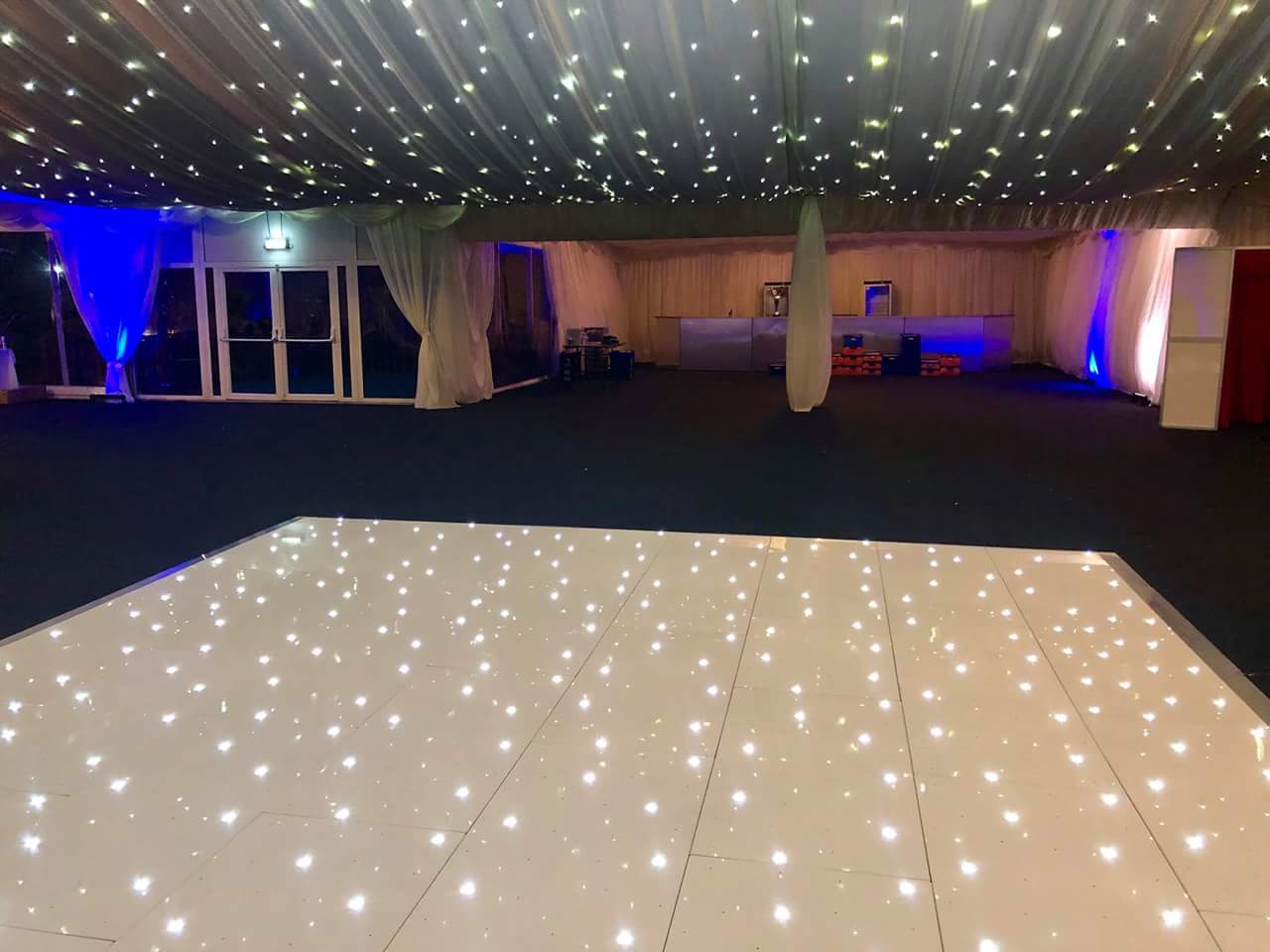 Marquee in Hilton Hall with star-lit ceiling, ideal for weddings and galas.