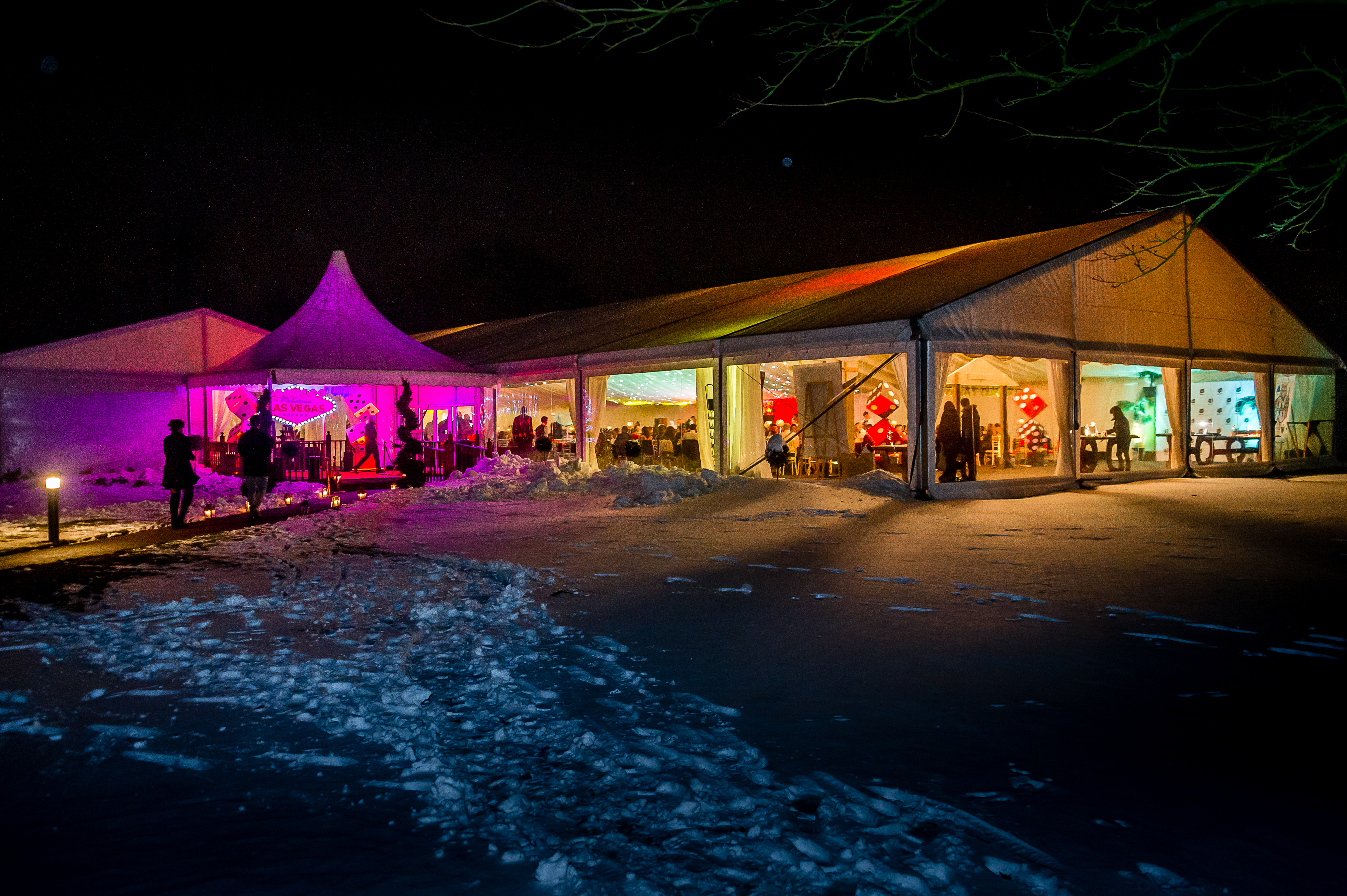 Illuminated event tent in snowy Hilton Hall, perfect for winter celebrations.