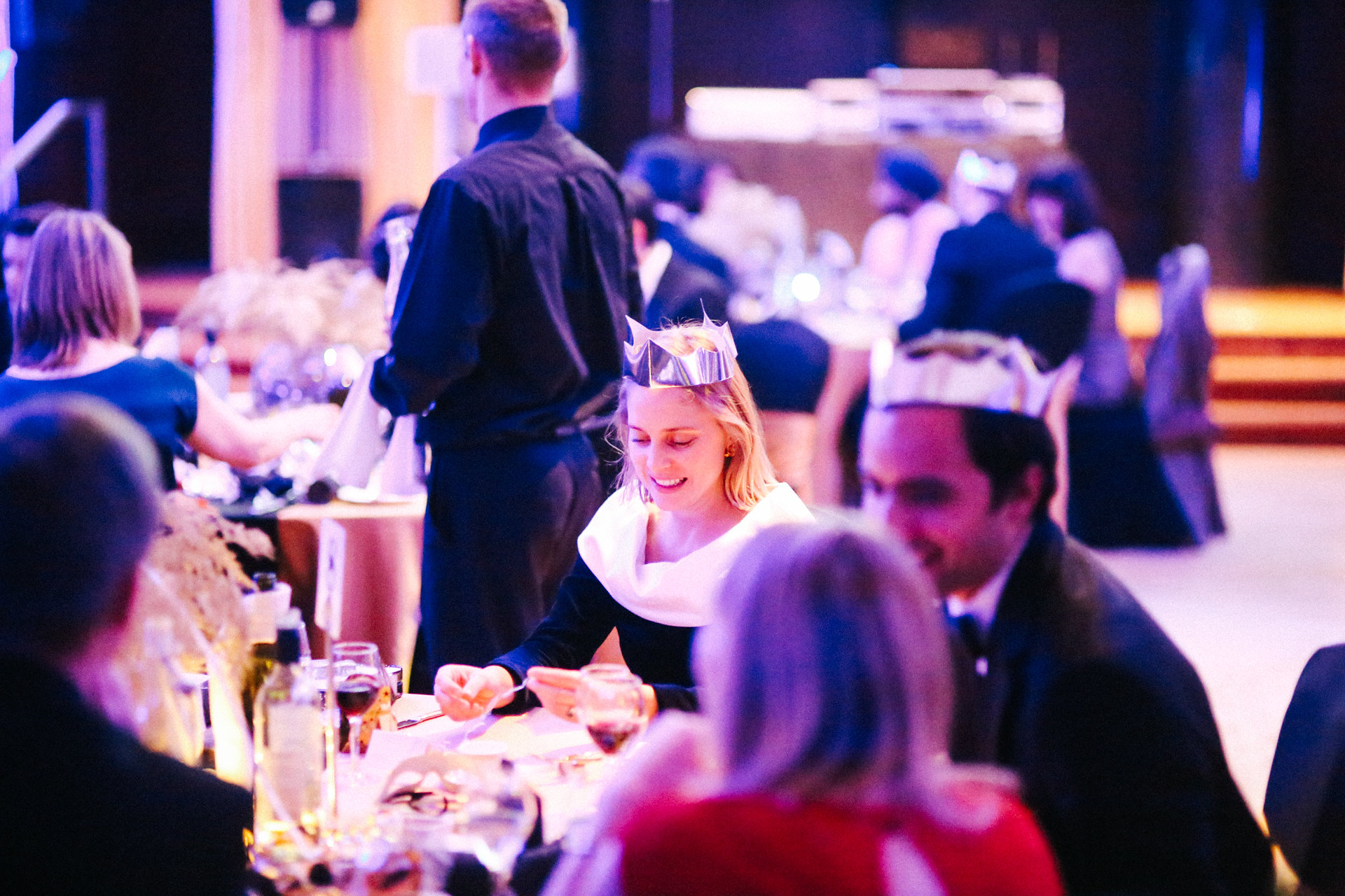 Carisbrooke Hall dinner event with guests, festive decor, networking opportunity.