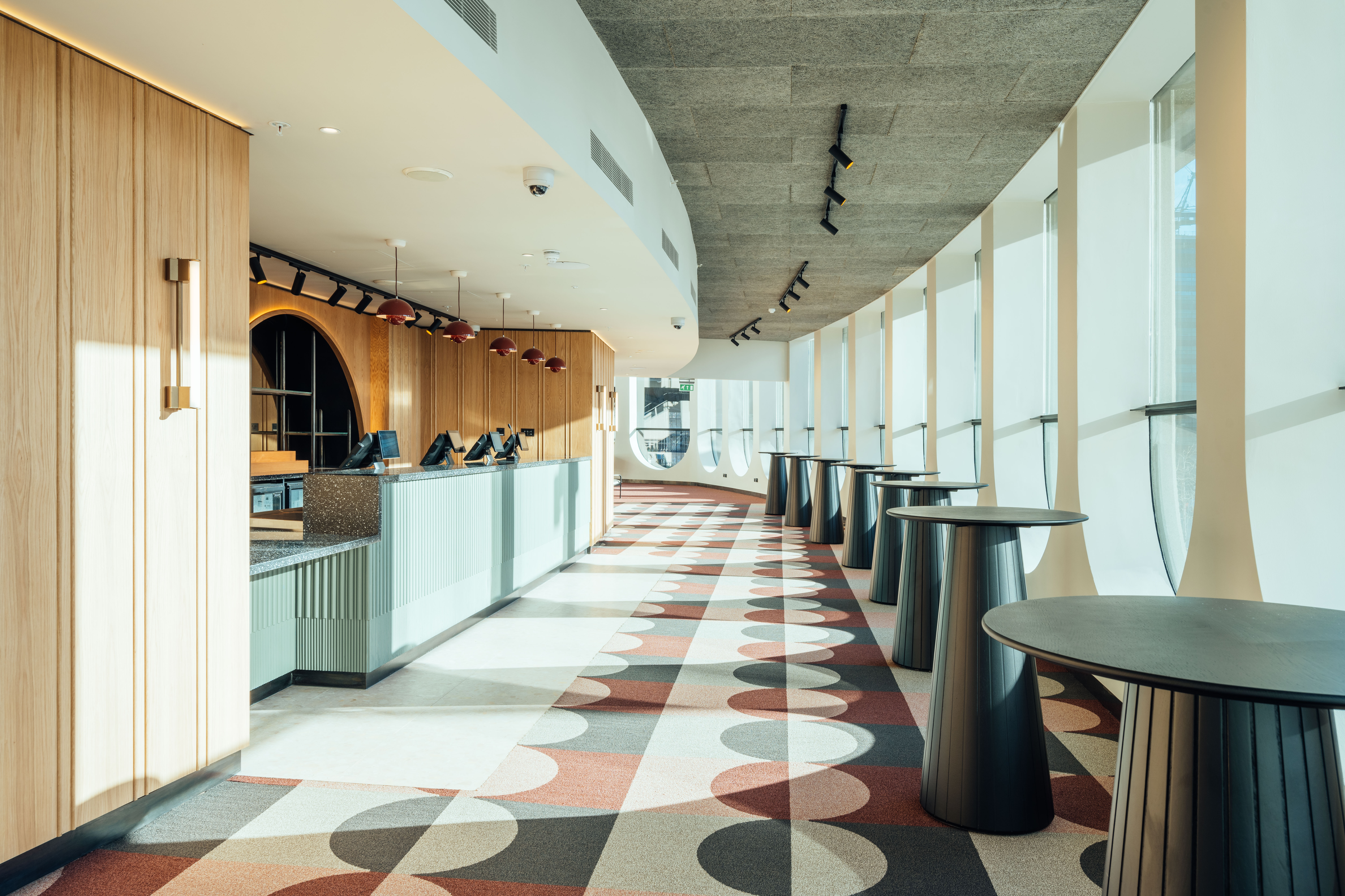 Modern event space in Unique Venues Birmingham with curved reception area, ideal for meetings.