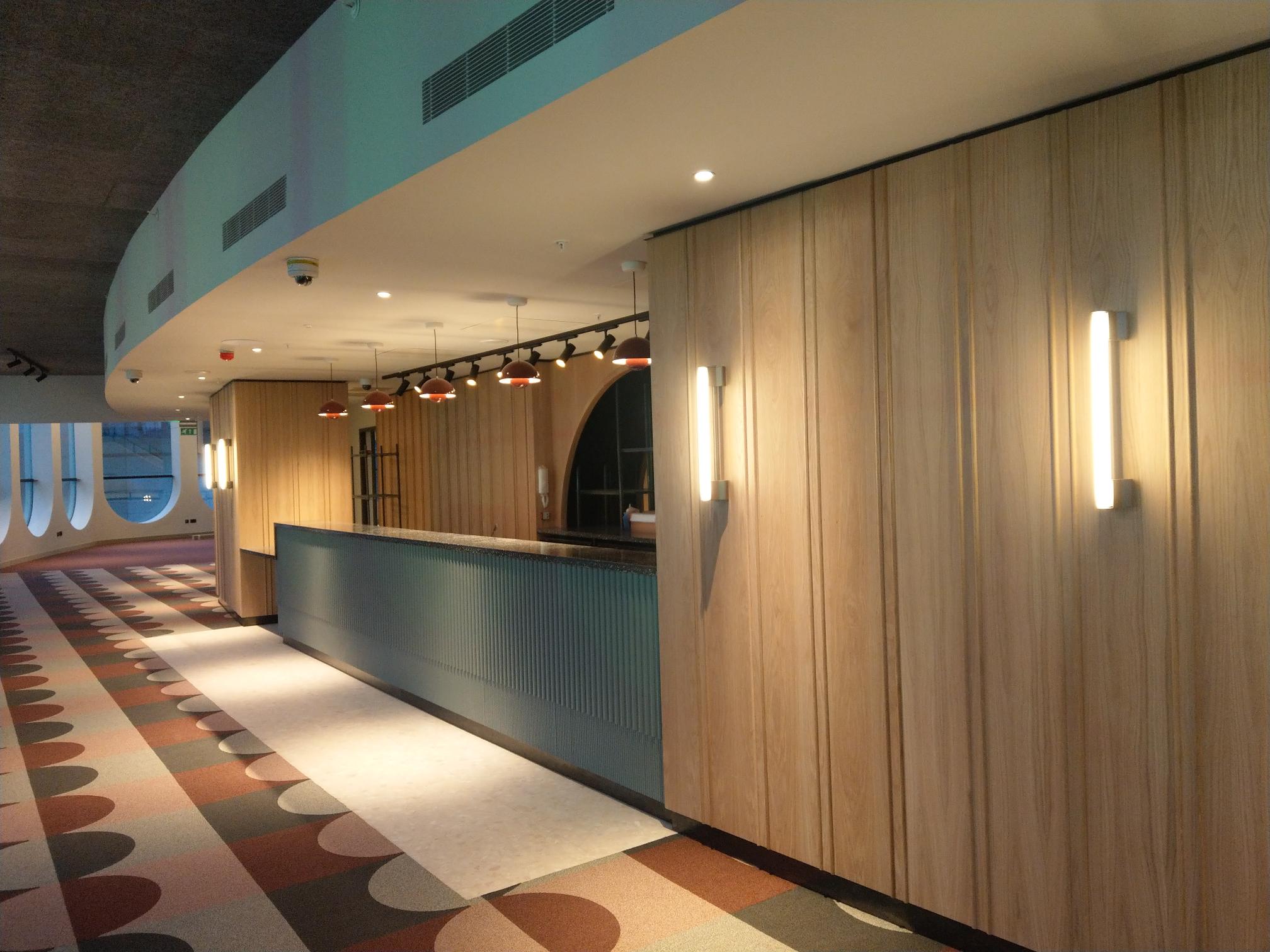 Modern event space in Birmingham with sleek bar, ideal for networking and receptions.